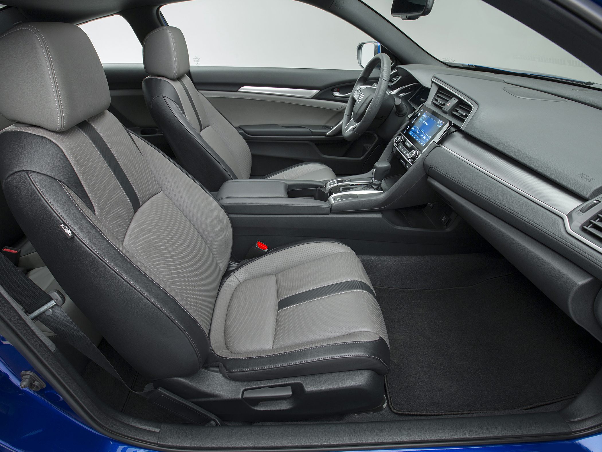 Modern seats, center console, and infotainment dashboard in car interior