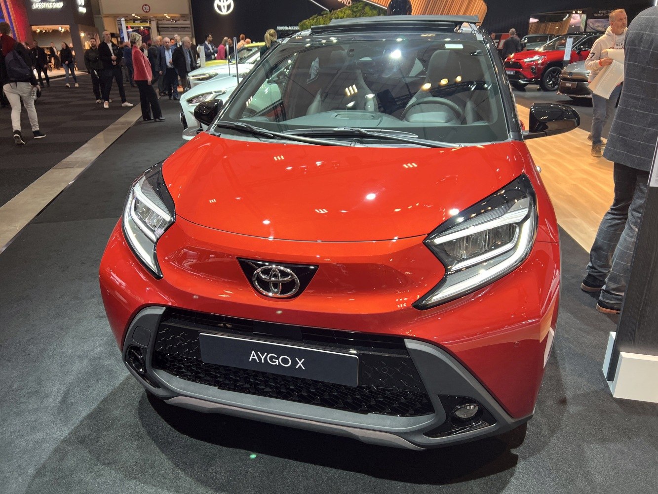 LED headlights and aggressive front grille of compact urban vehicle