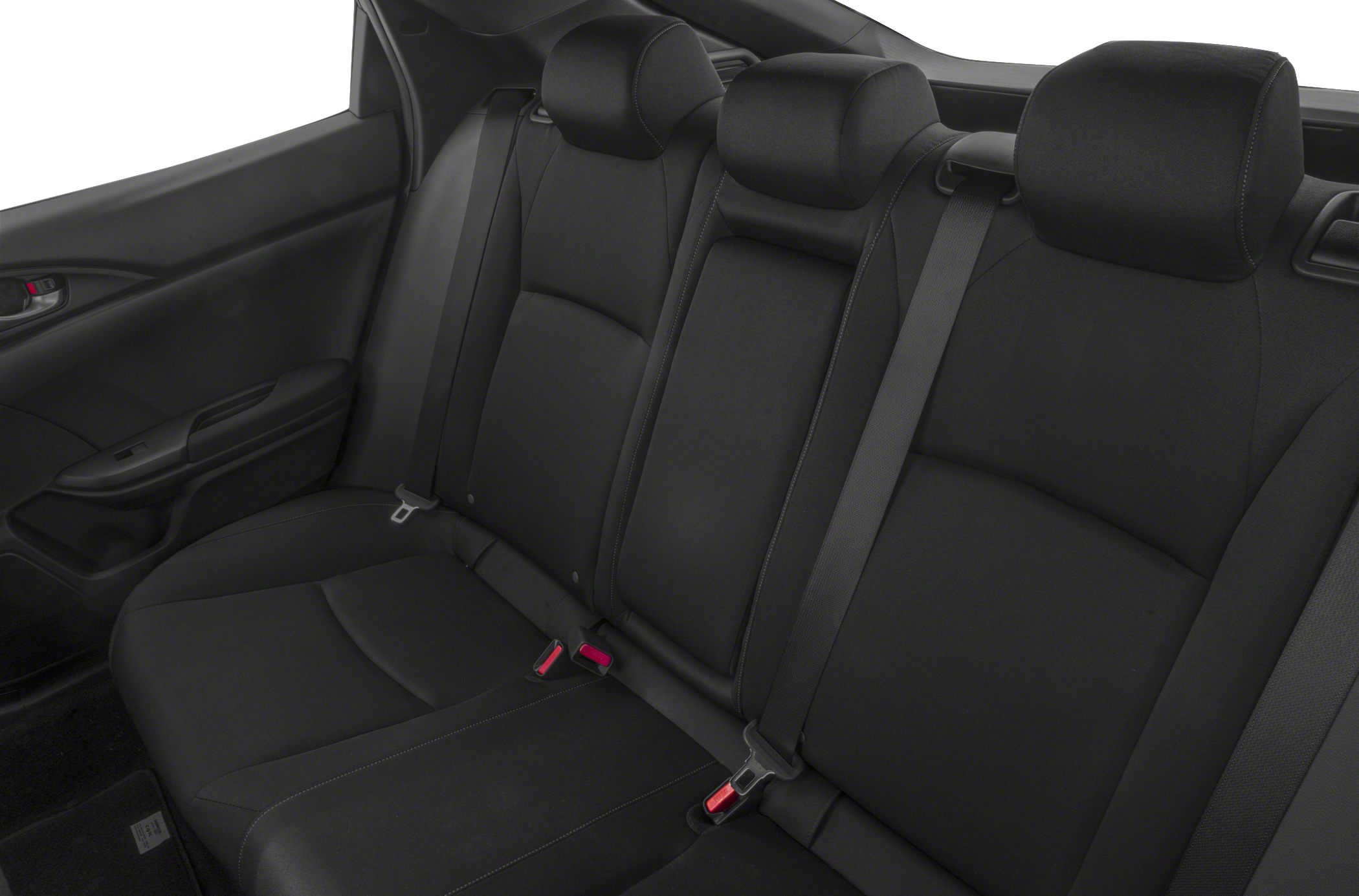 Rear seat with black upholstery, headrests, and seatbelts.