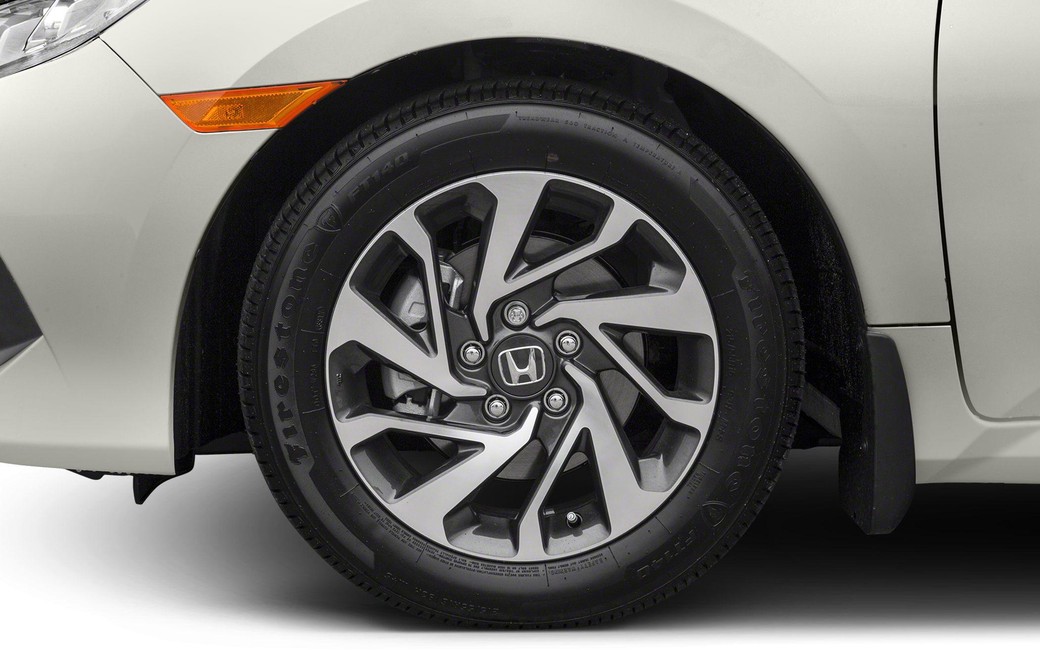 Alloy wheel and tire close-up of a vehicle with detailed rim design.
