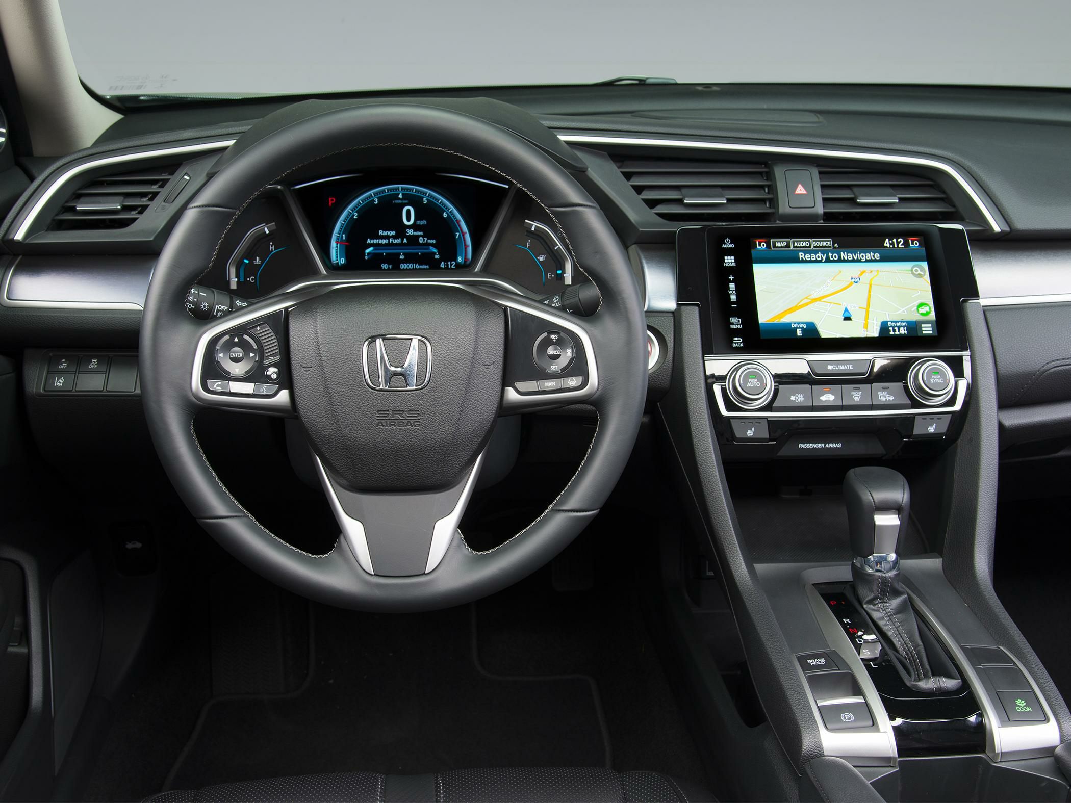 Steering wheel, digital instrument cluster, infotainment and gear shift