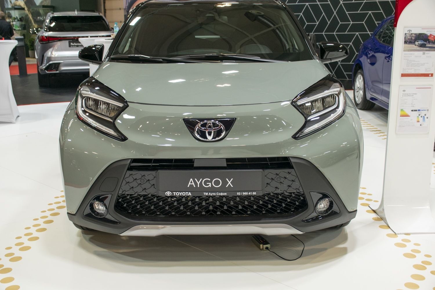 Front view with distinct LED headlights and a wide mesh grille
