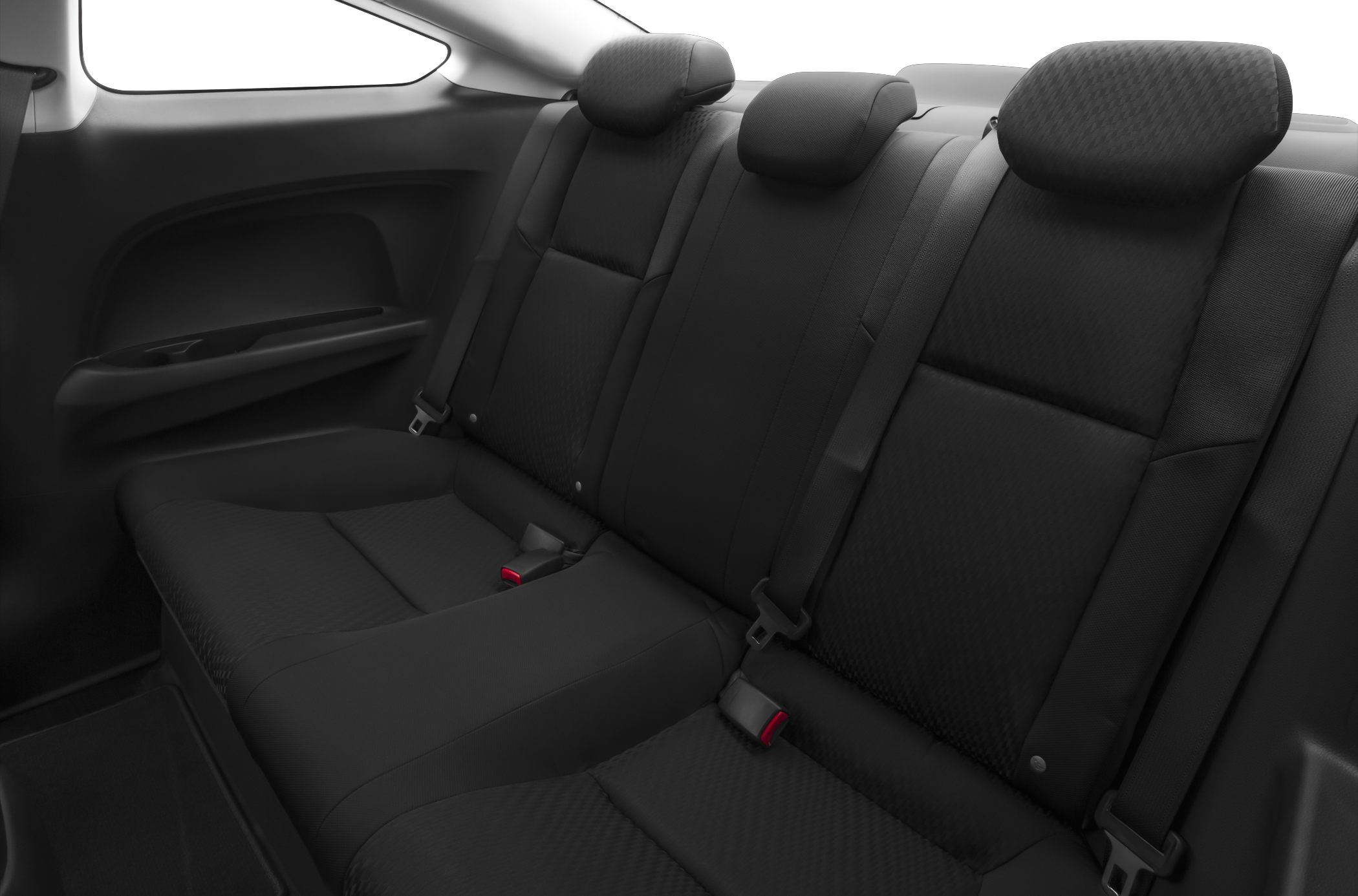 Black fabric rear seats with headrests and seat belts in a compact coupe.