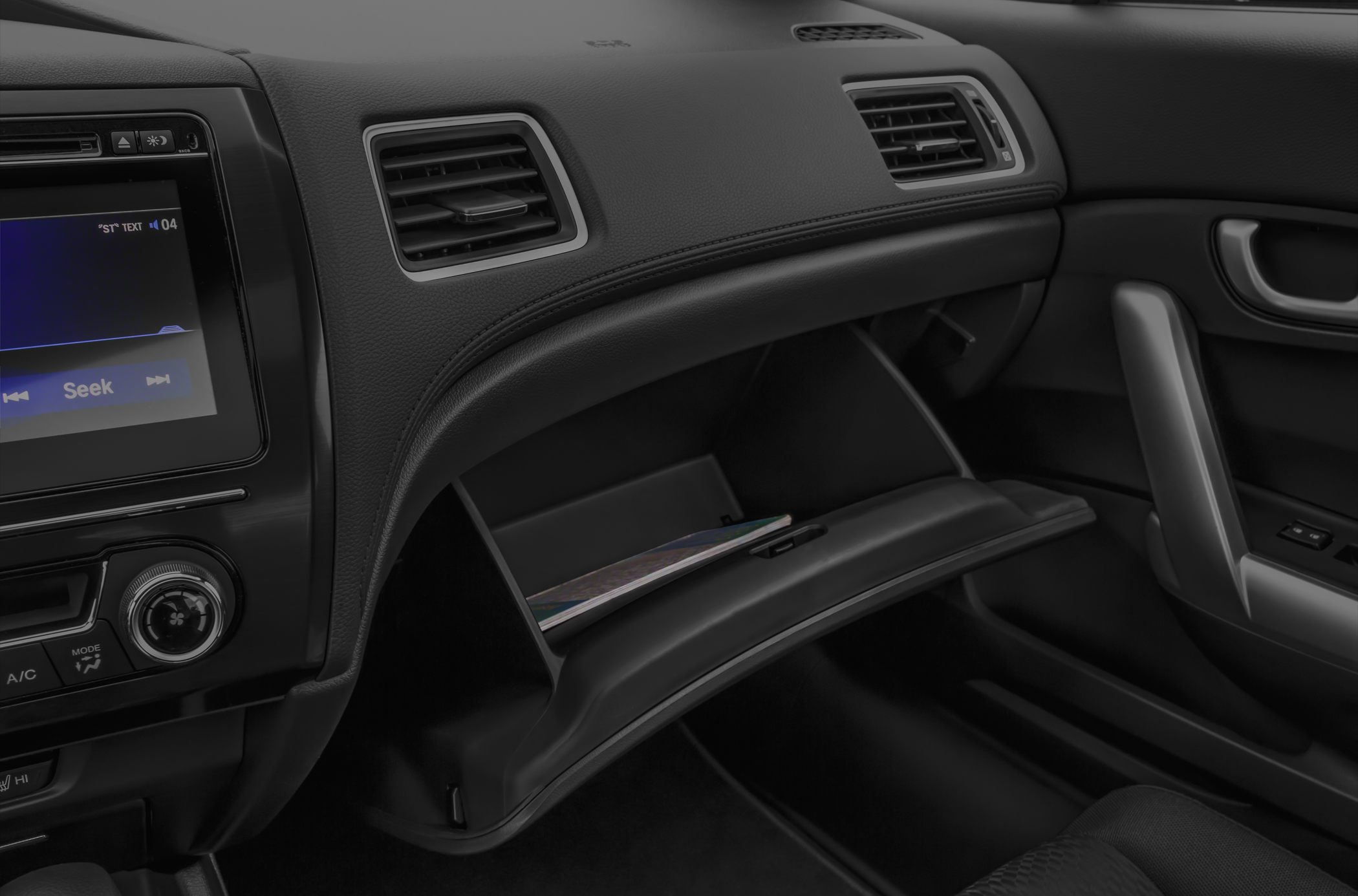 Open glove compartment and dashboard vent details