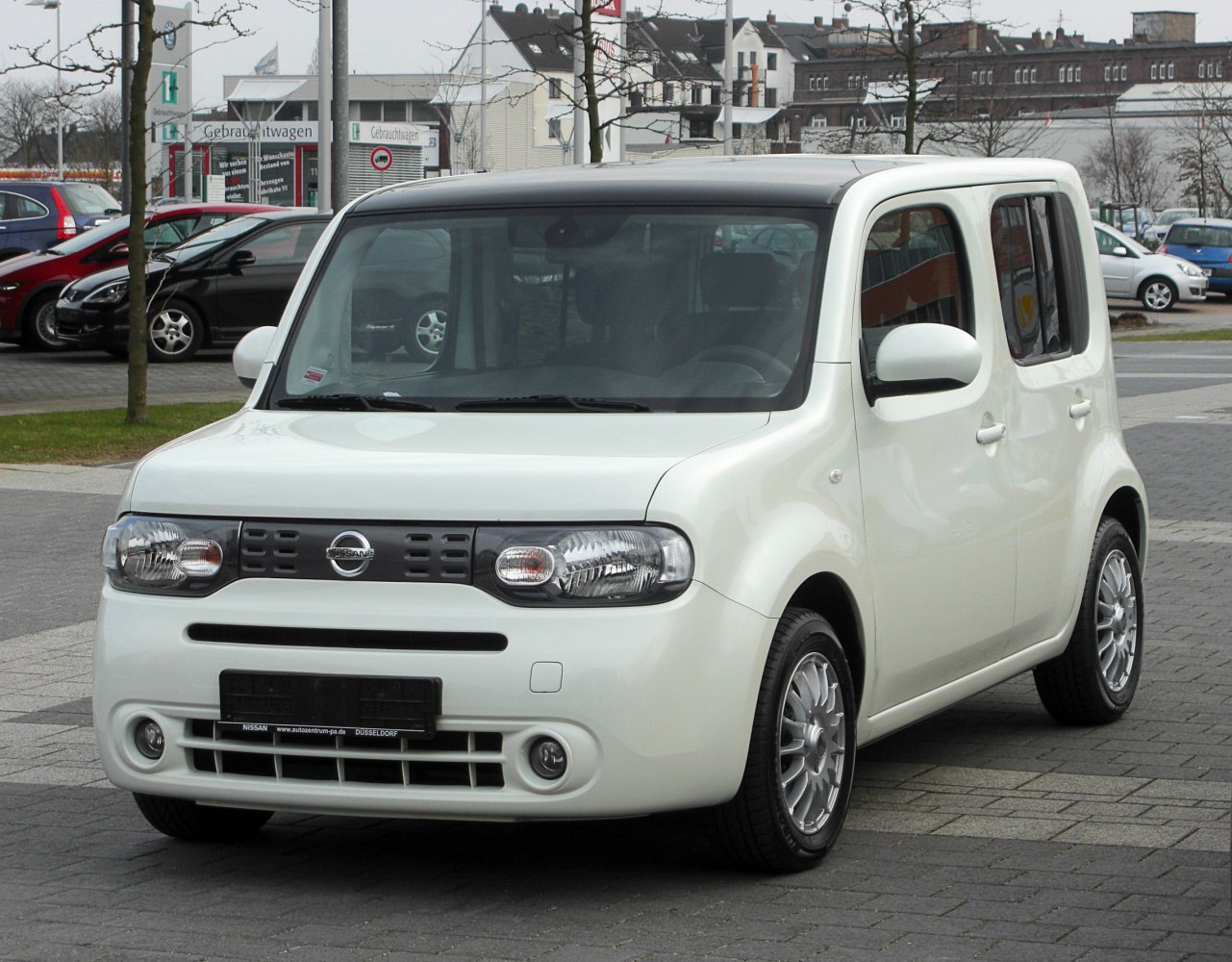 Boxy compact car front design with distinctive curved edges