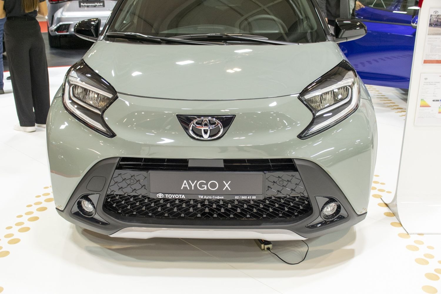 Front view with distinctive headlights and grille
