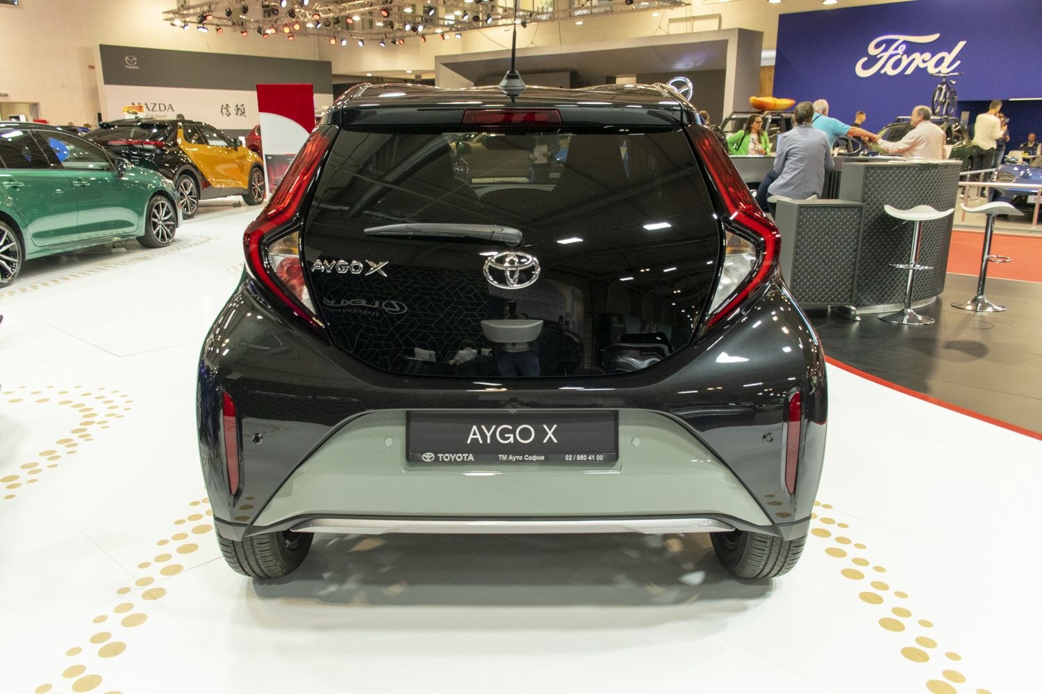 Rear view of compact hatchback with distinctive taillights and large rear window