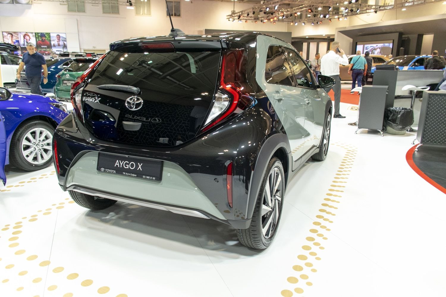 Rear view with modern tail lights and two-tone body design.