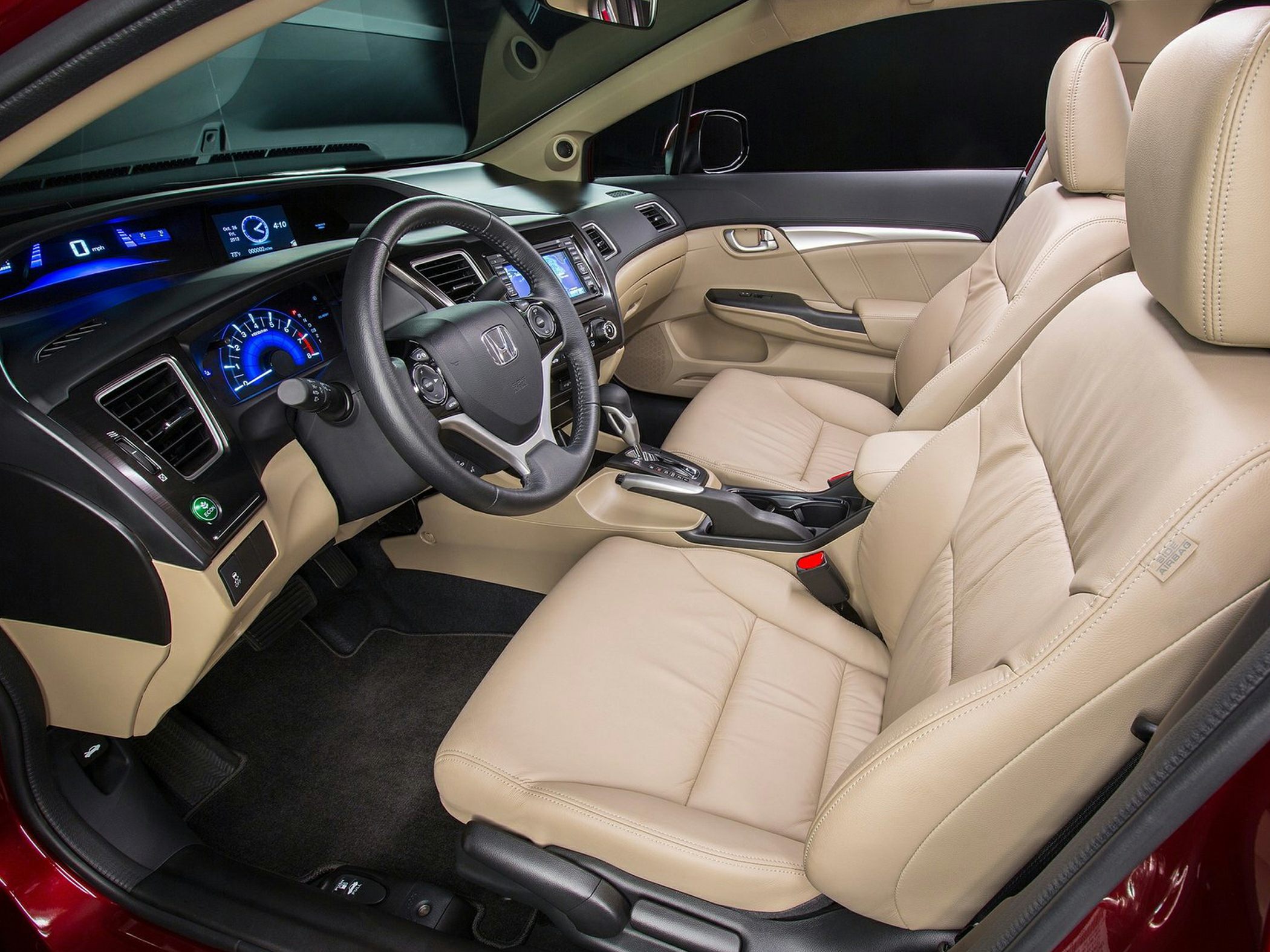 Beige leather seats with digital dashboard and modern steering wheel design
