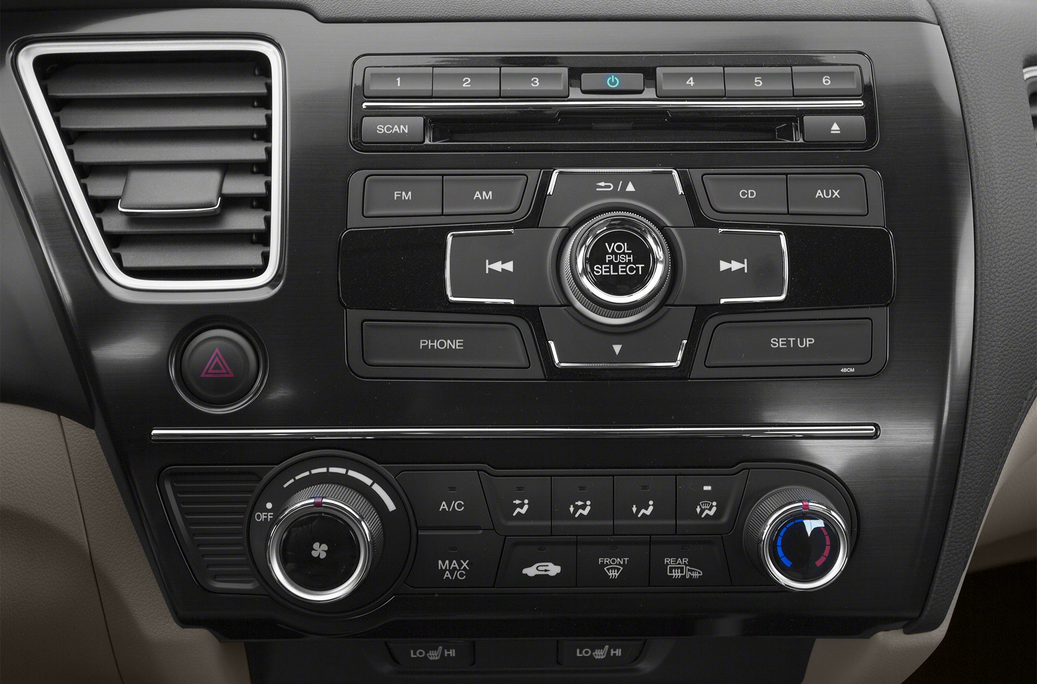 Close-up of audio controls and climate control knobs in car interior