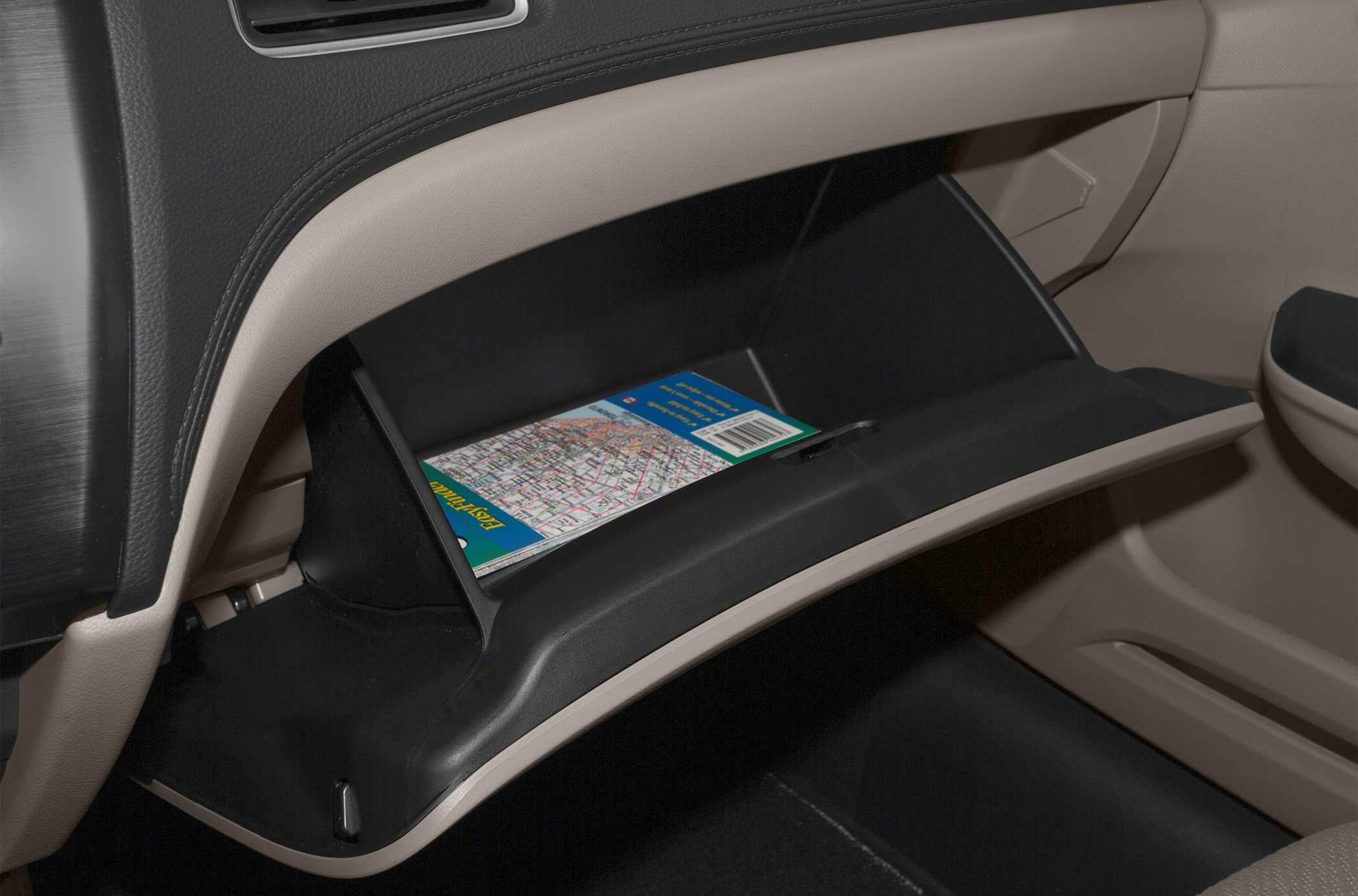 Open glove compartment with storage space and map inside