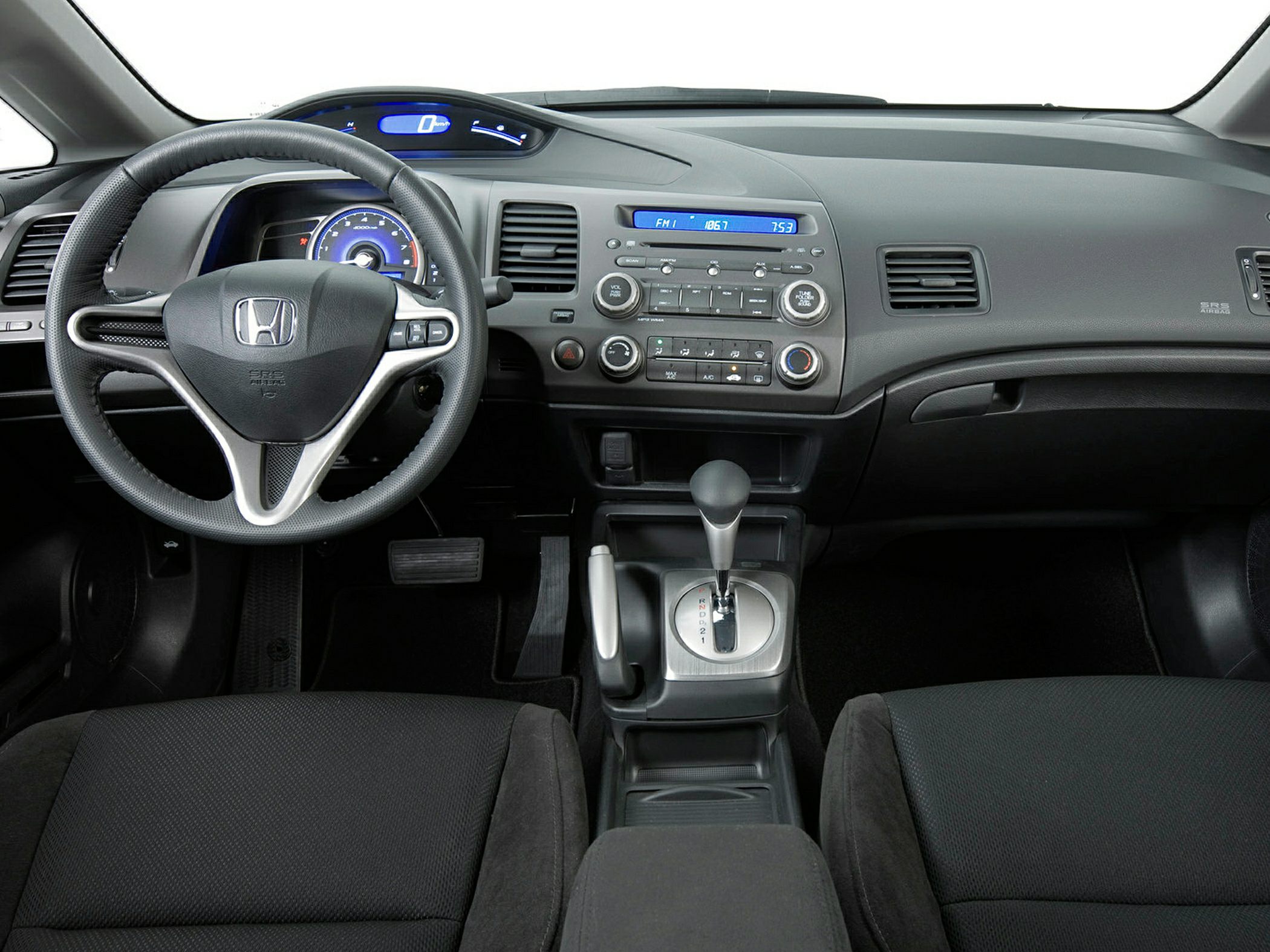 Dashboard, steering wheel, gear shifter, radio console, air vents
