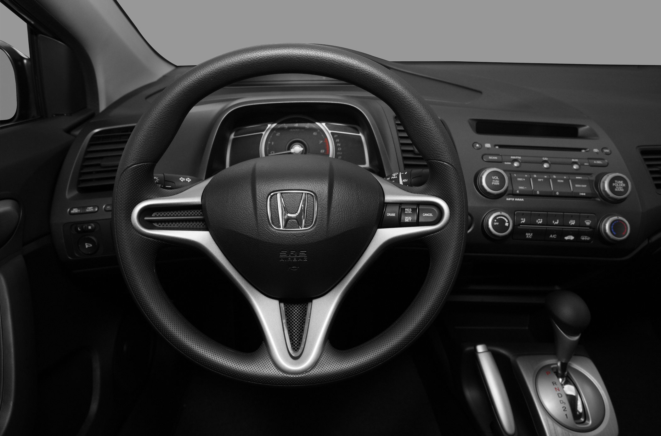 Multifunction steering wheel and center console with gear shift and controls