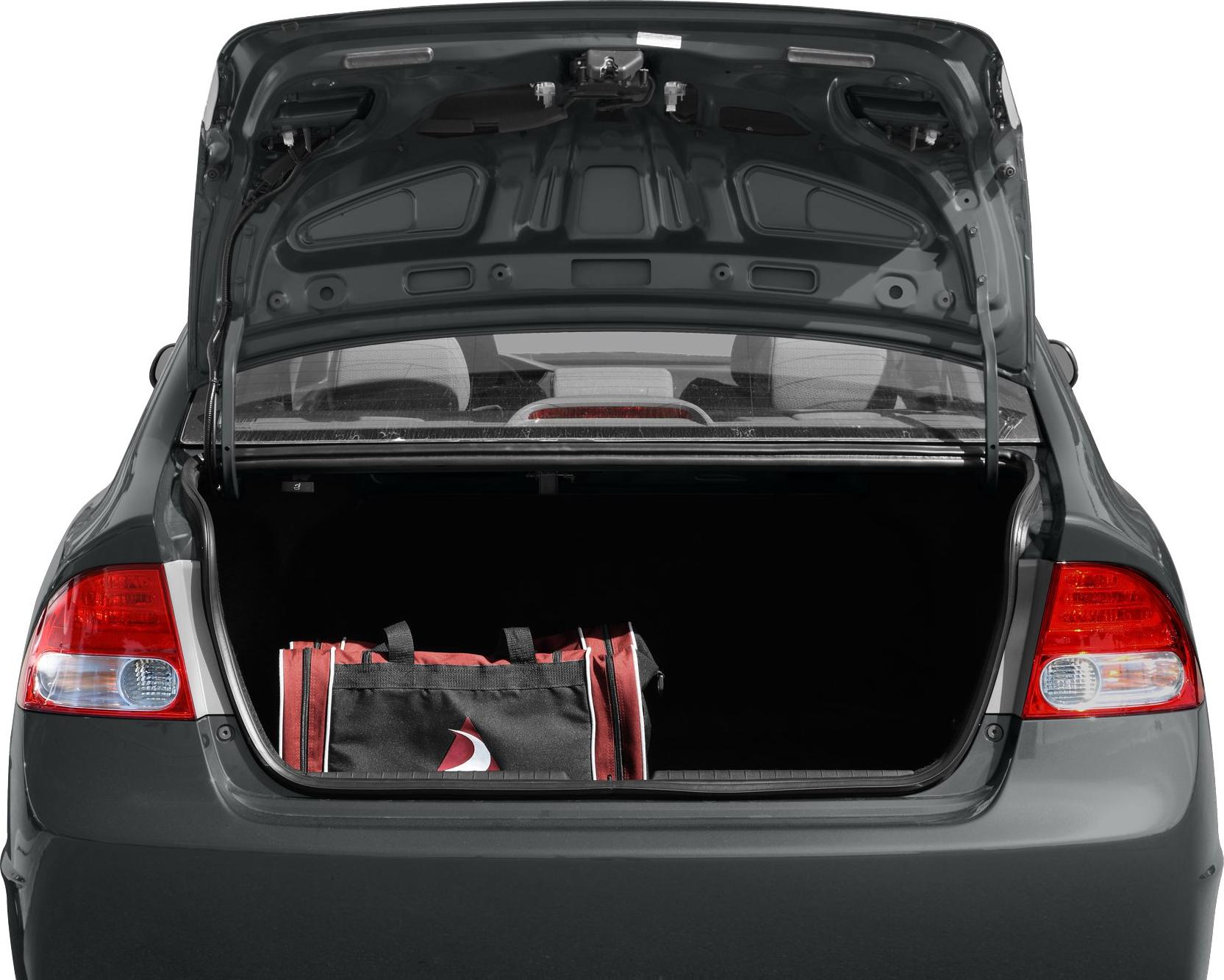 Open car trunk showing spacious cargo area with a bag inside.