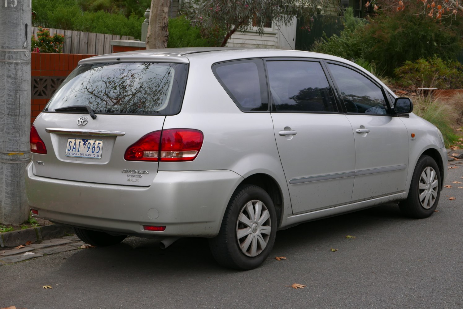 Rear and side profile of a silver compact MPV with distinctive rear lights