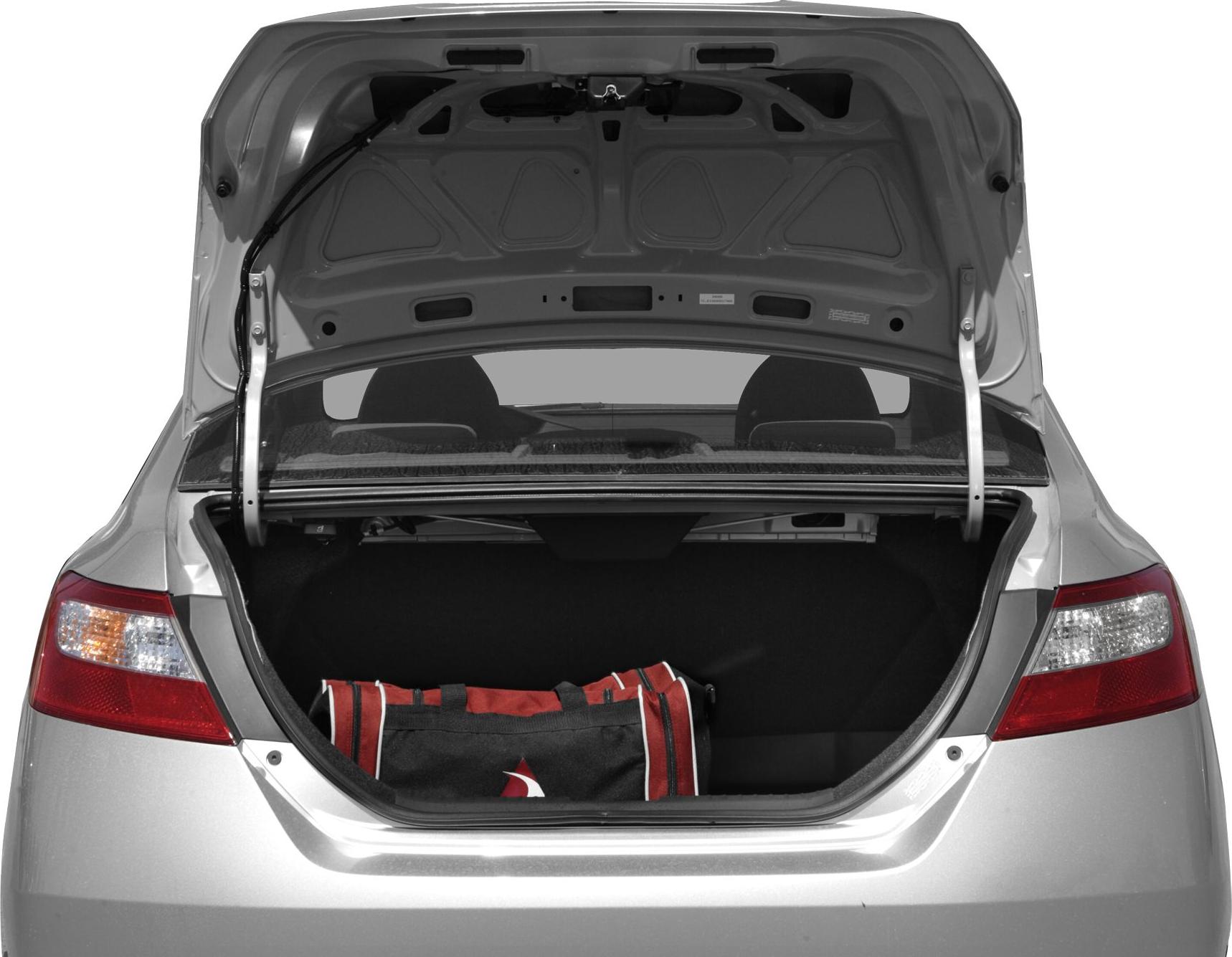 Open trunk of a compact coupe with a bag inside
