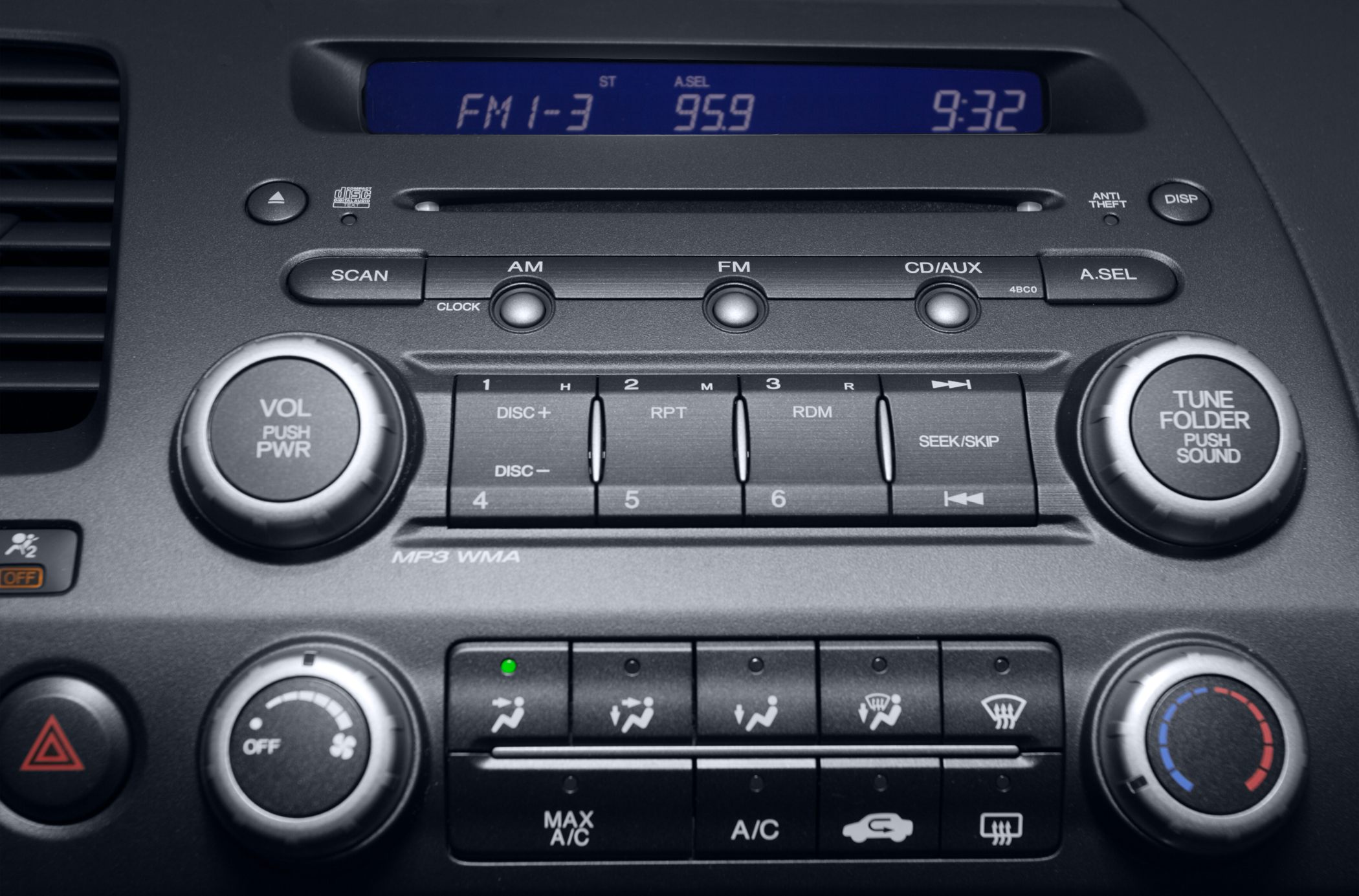 Radio and climate control panel with AM/FM, CD, AUX, and manual A/C knobs