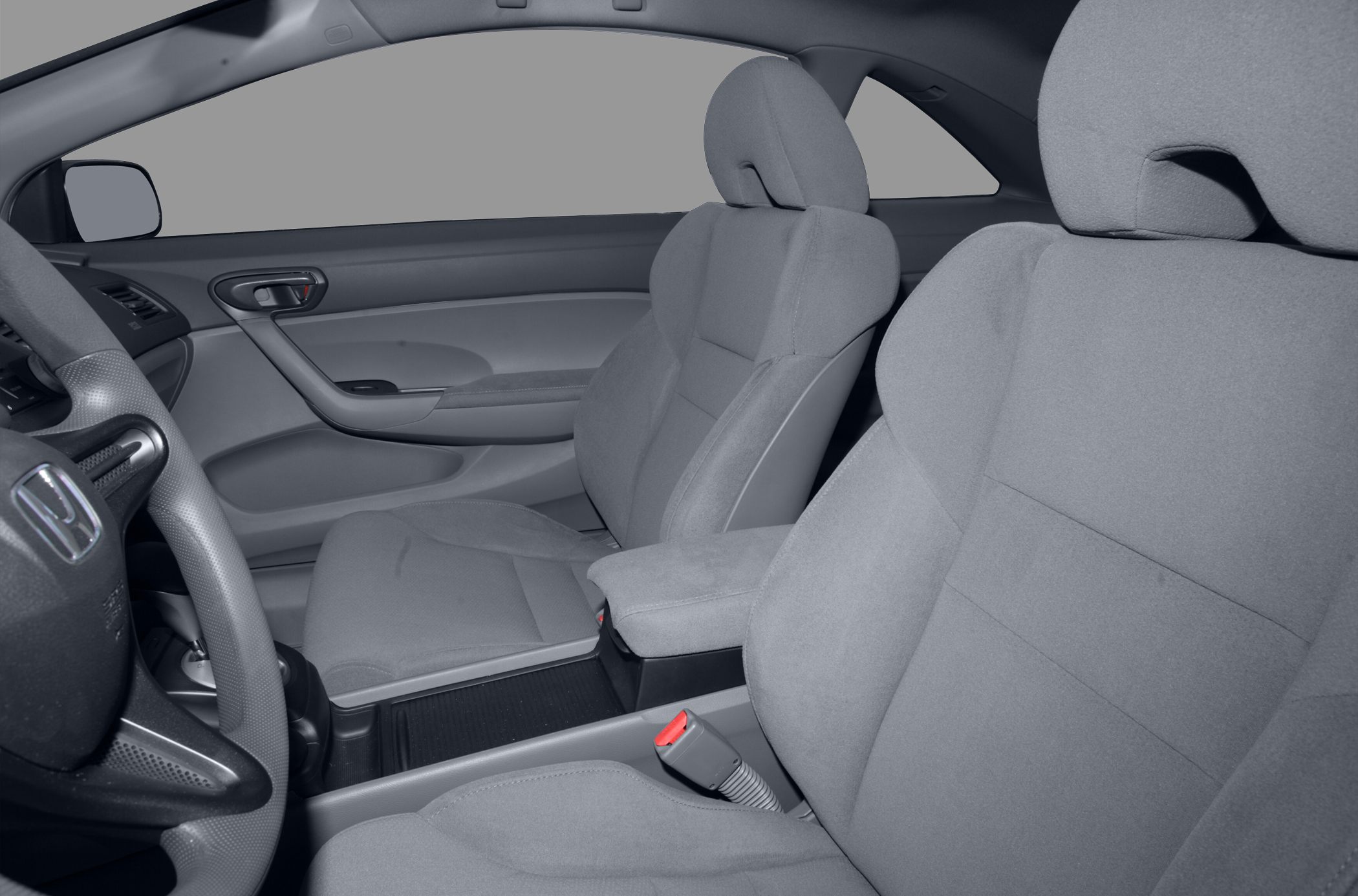 Front seats, steering wheel, and door panel with grey fabric upholstery