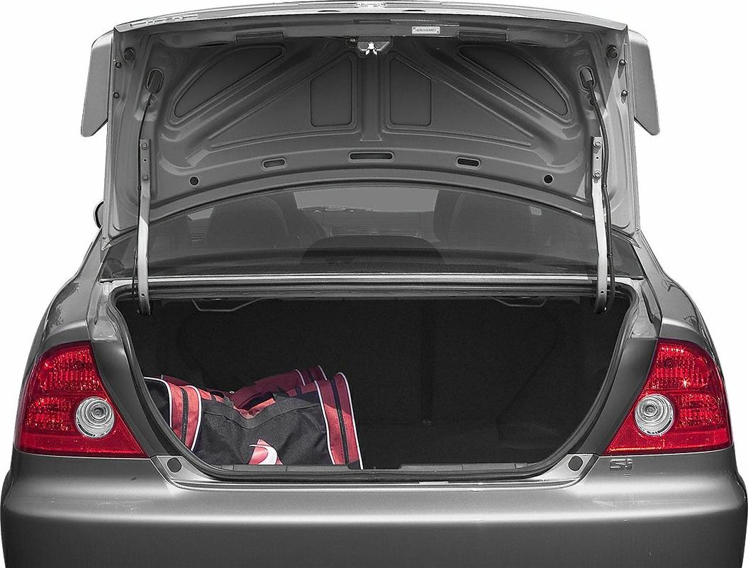 Open car trunk with visible cargo space and duffel bag