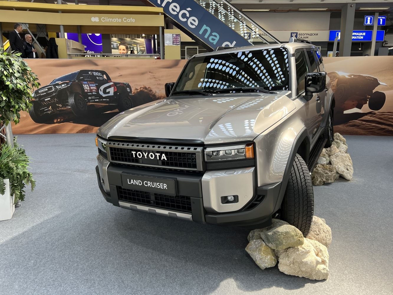Front view of rugged SUV with LED headlights and off-road tires on rocks