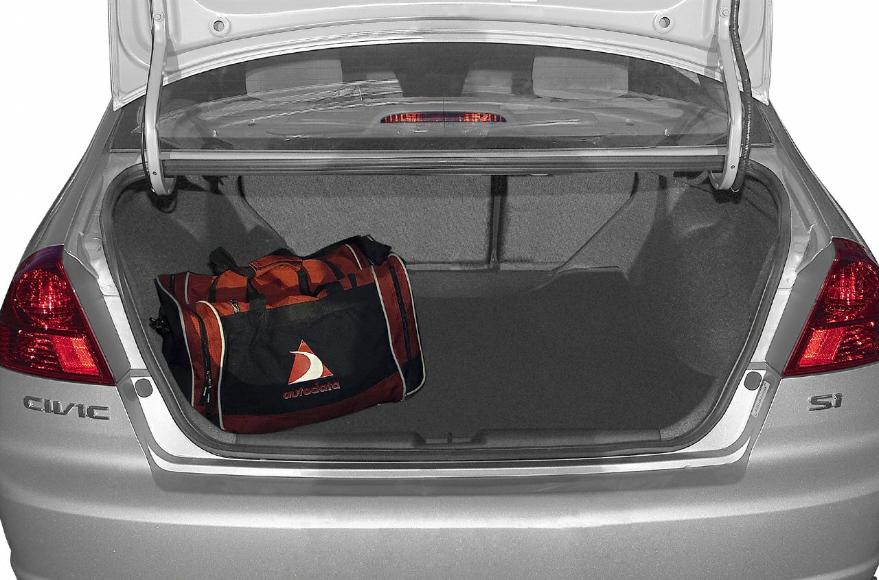 Spacious sedan trunk interior with sports bag