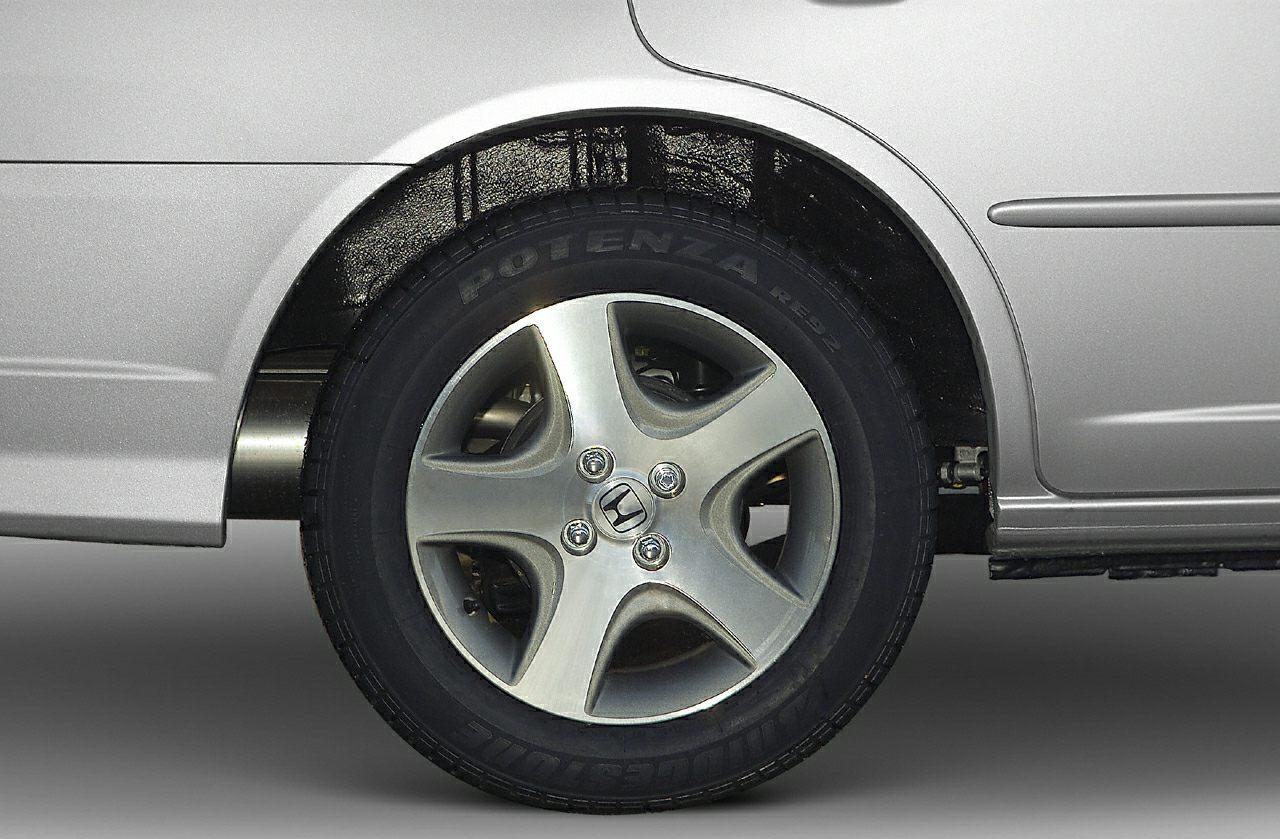 Alloy wheel and branded tire close-up with visible tire lettering and rim design