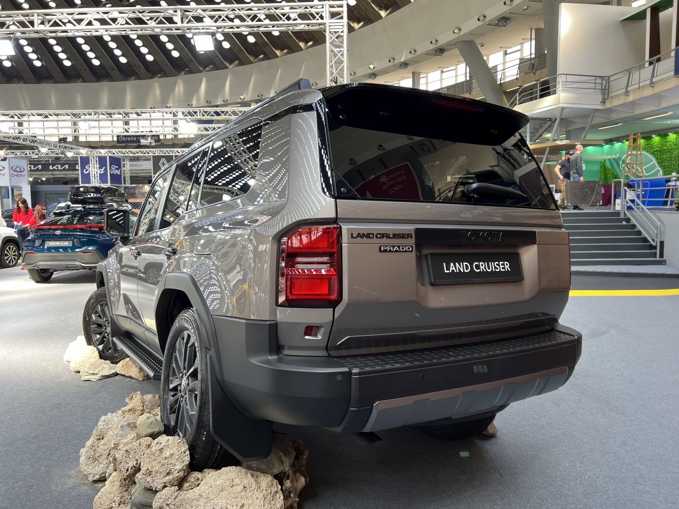 Rear view of SUV on rocky terrain showing off-road capability and modern tail light design