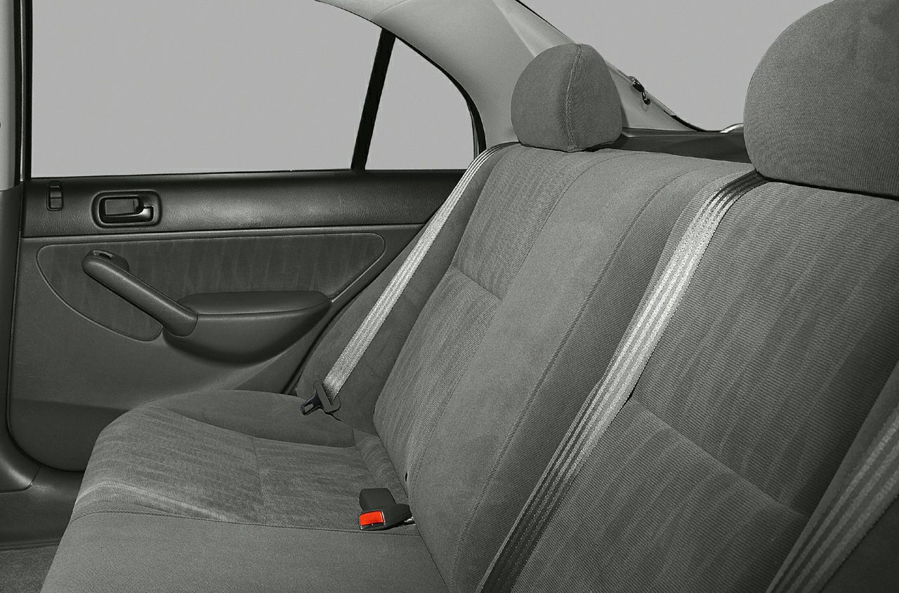 Fabric rear seat and door panel with seatbelt in sedan interior