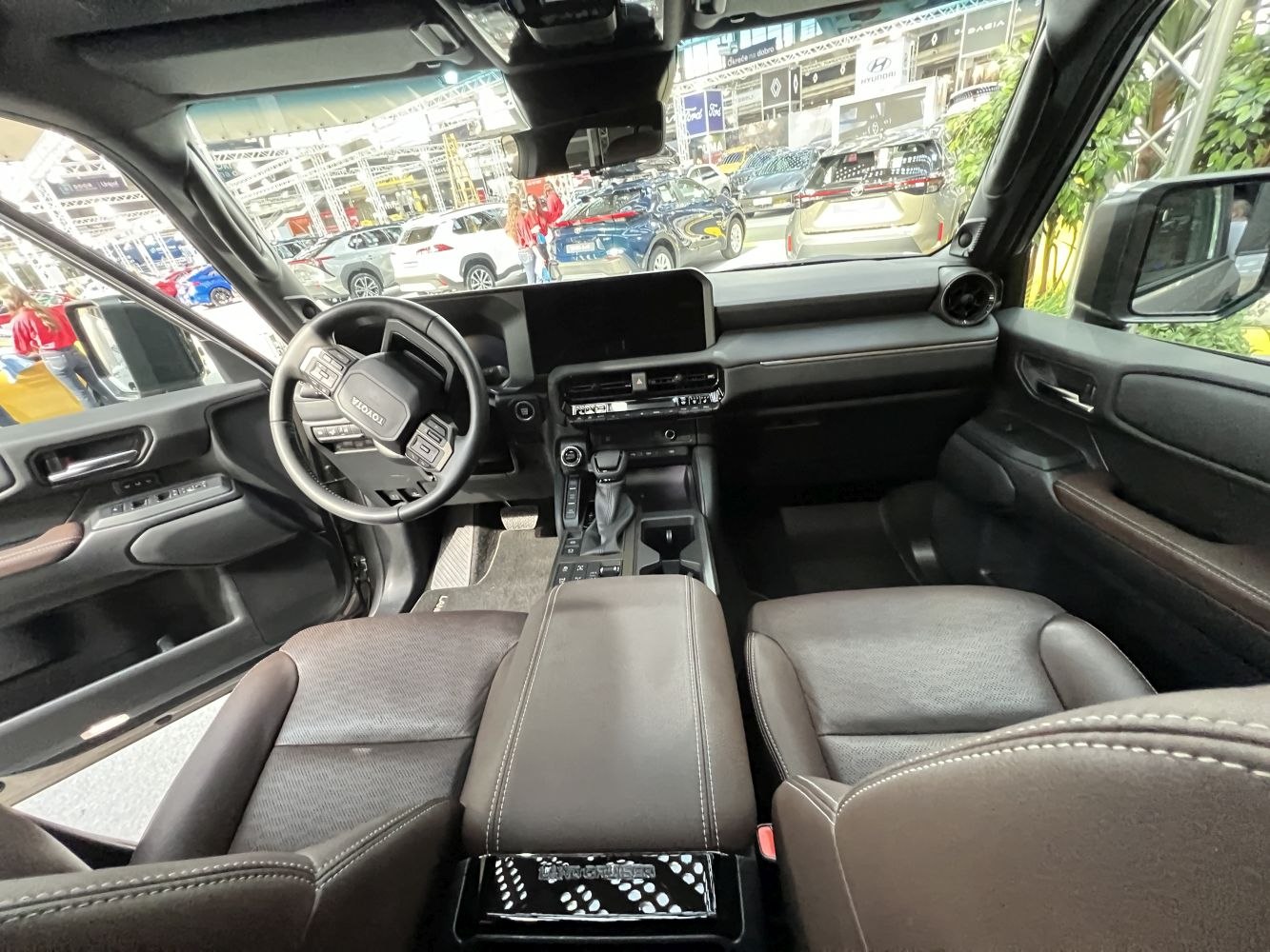 Modern dashboard and premium seating interior with digital display and multifunction steering wheel.