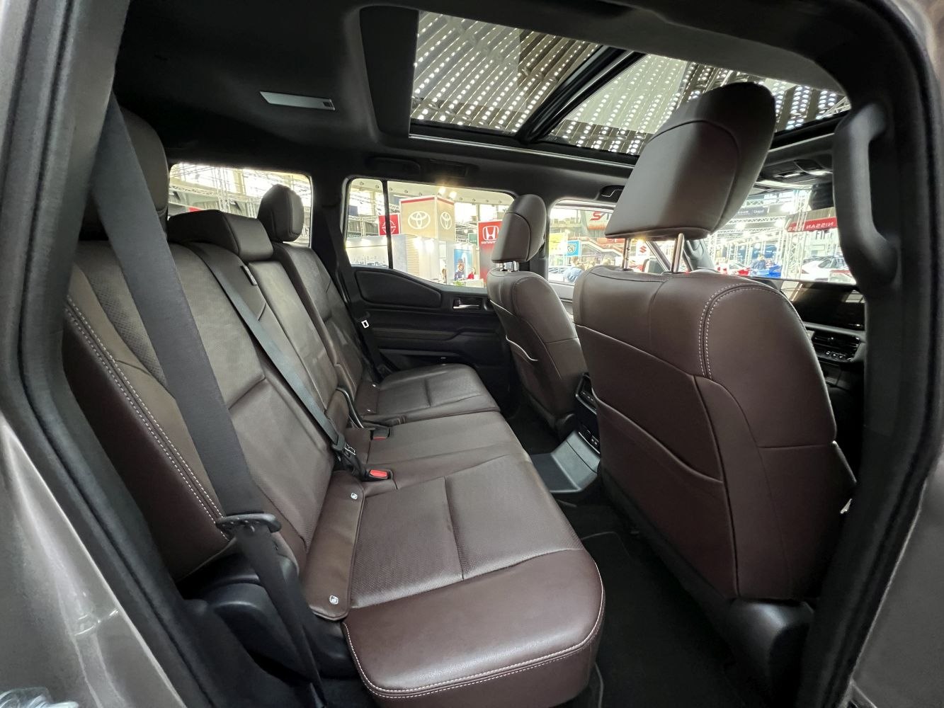 Spacious rear seats and panoramic sunroof in SUV interior