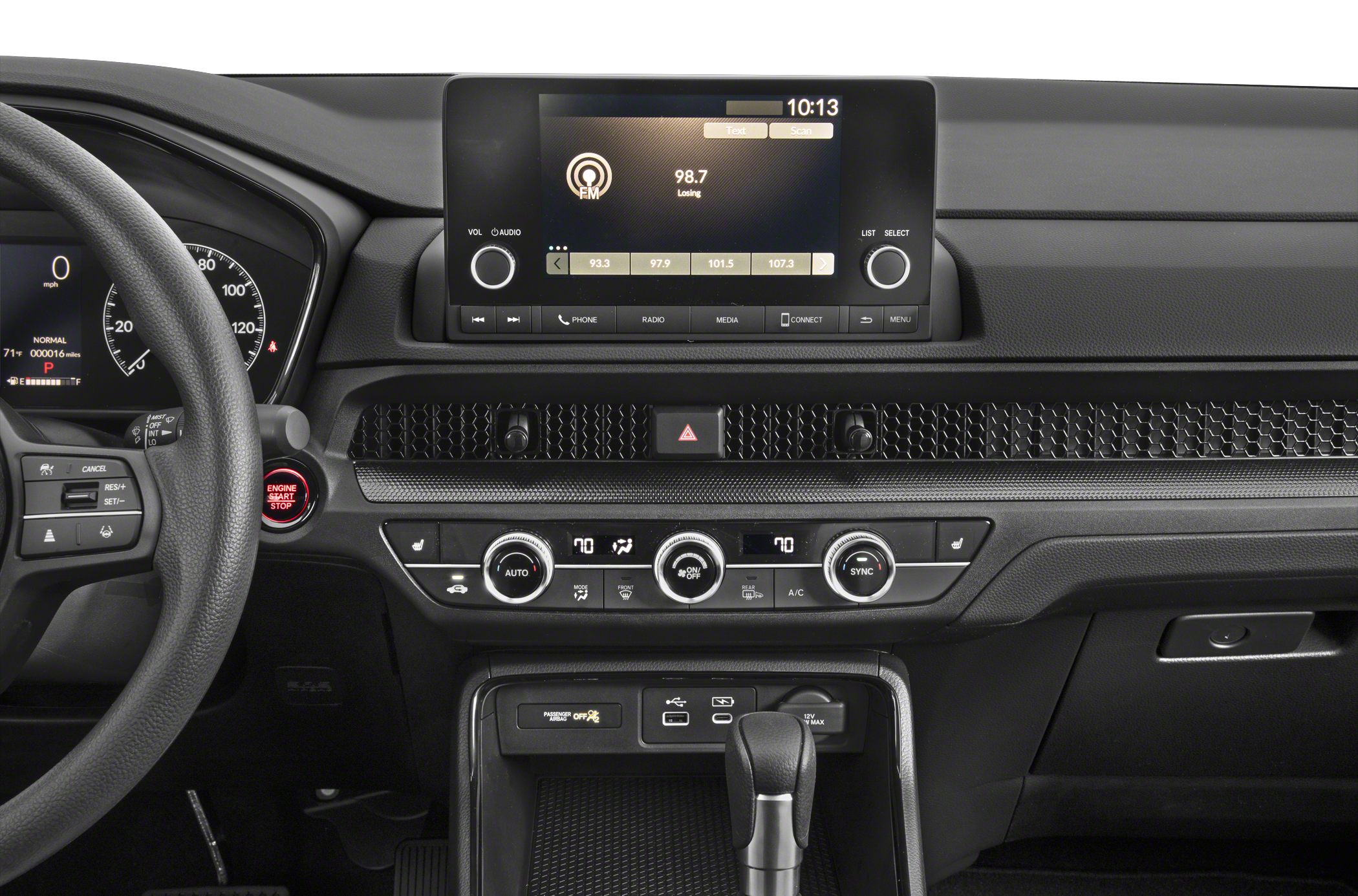 Modern car dashboard with digital display and climate control knobs