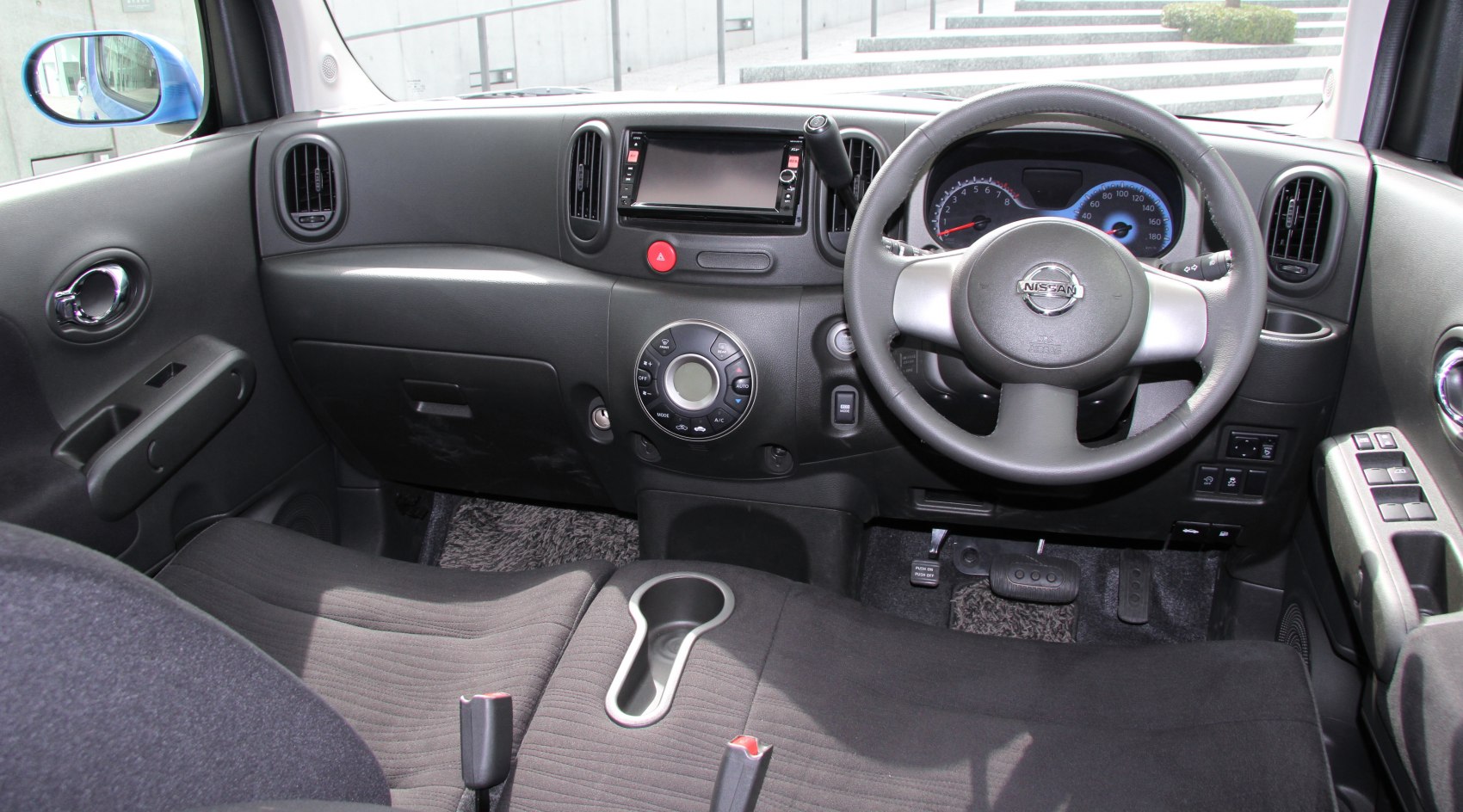 Dashboard and steering wheel with control panel and air vents