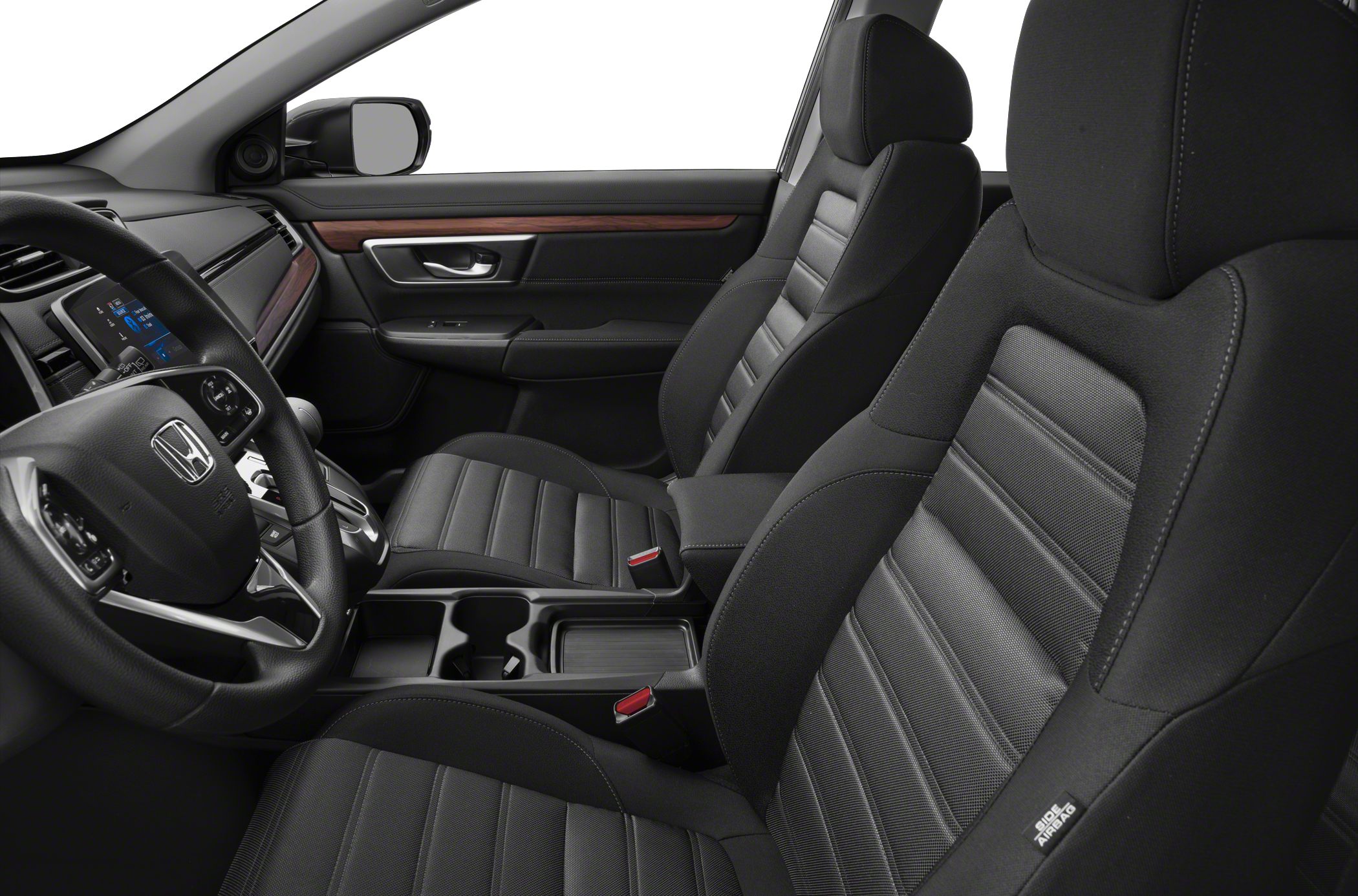 Ergonomic front seats and modern dashboard design with wood trim accents.