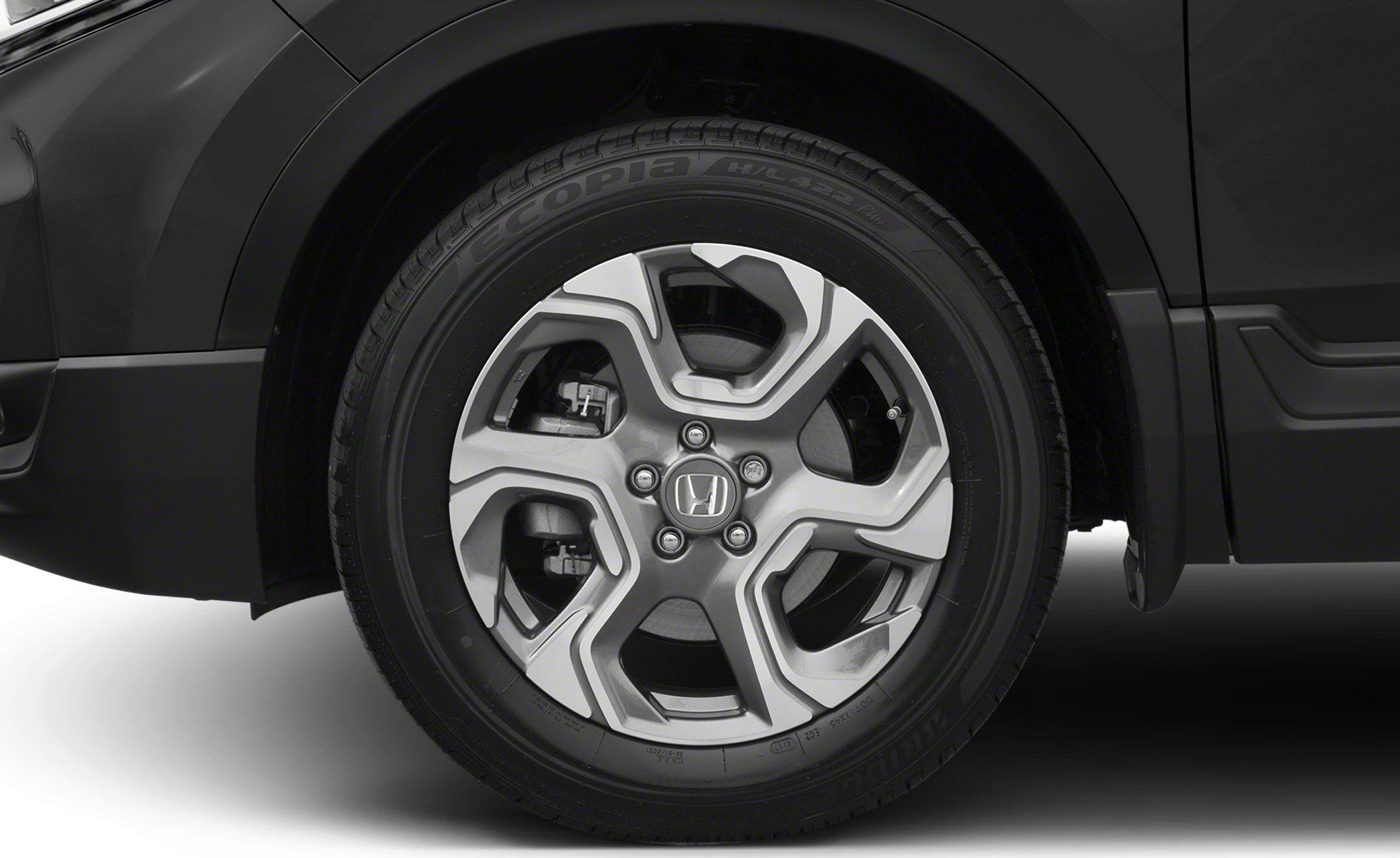 Alloy wheel and tire close-up with brake system details