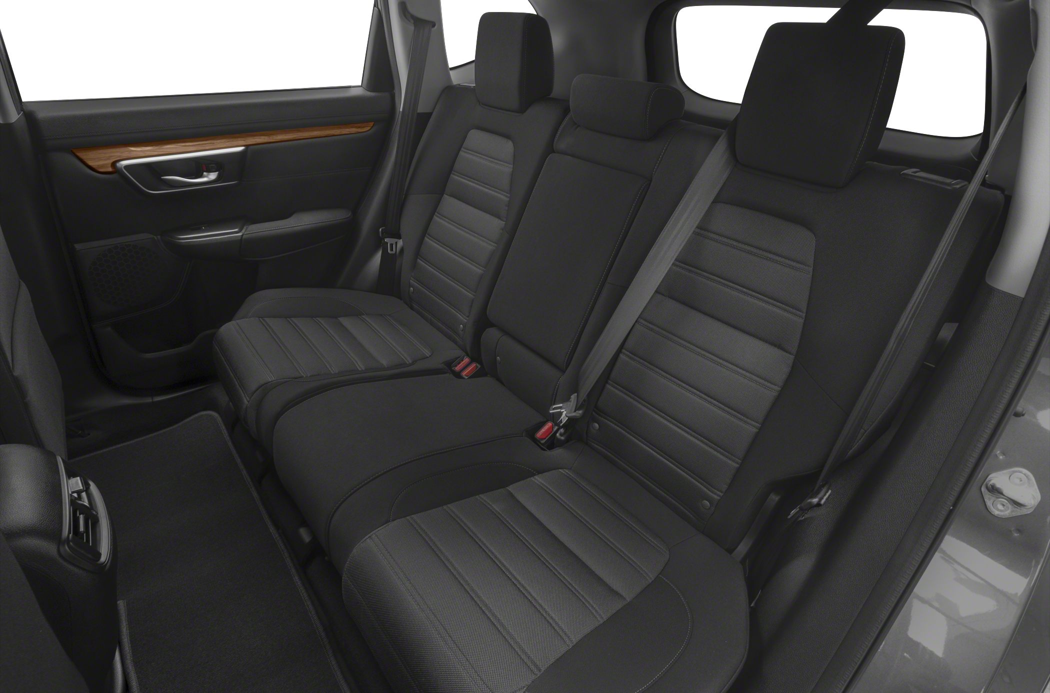 Black leather rear seats with wooden trim and seat belts