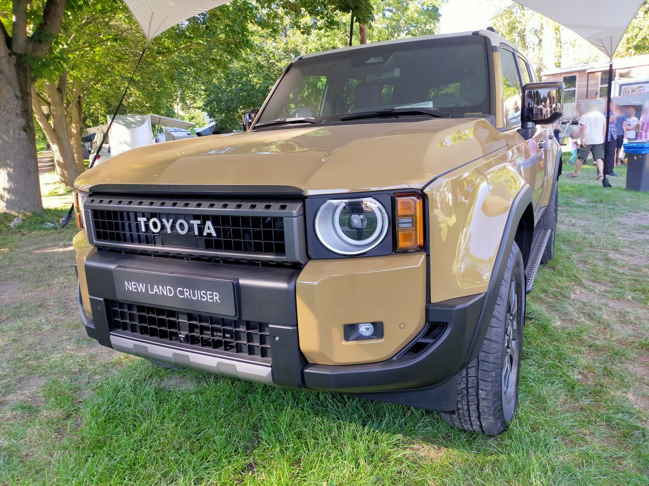Front grille and round LED headlights of a modern off-road SUV