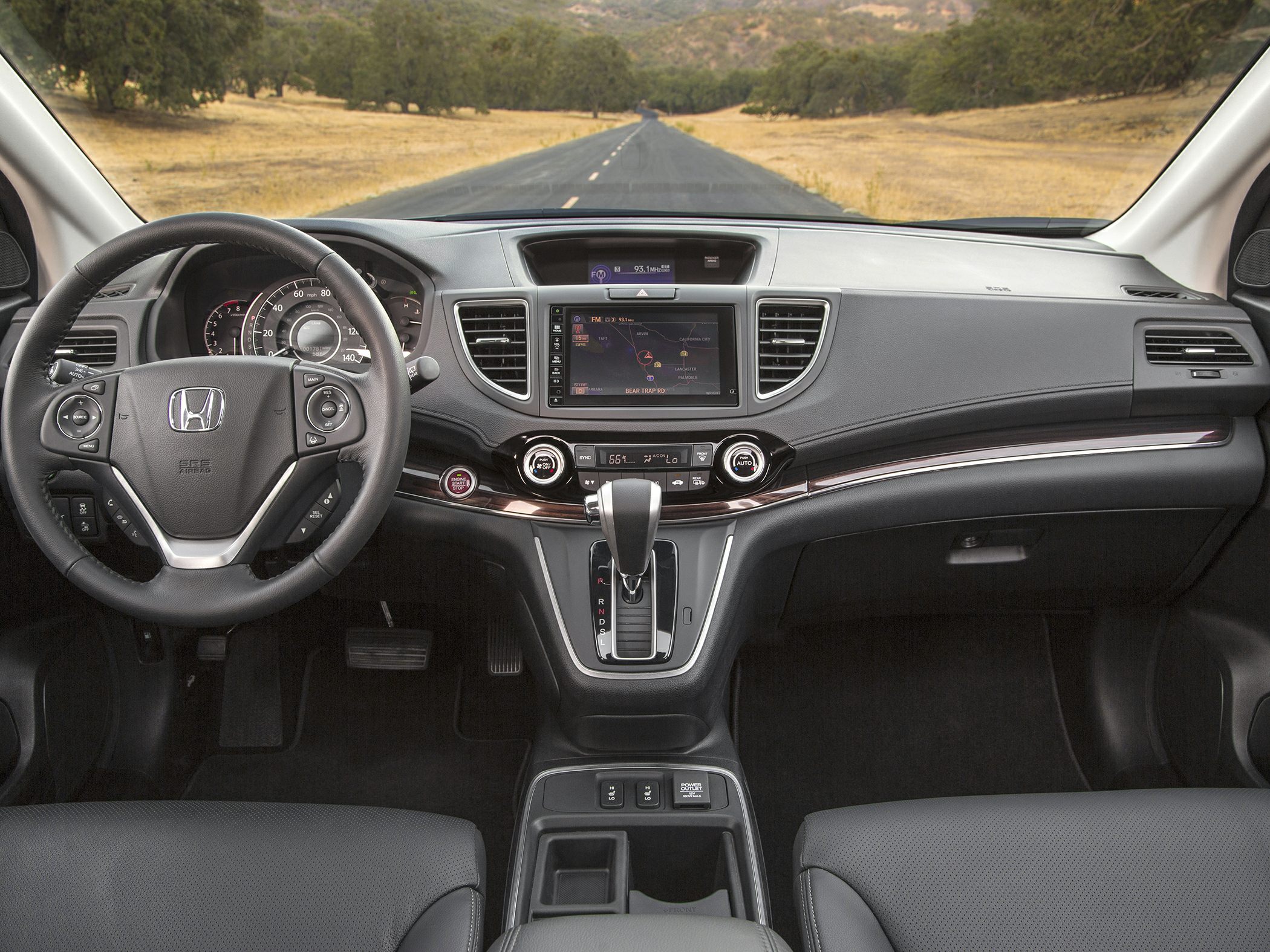 Dashboard with infotainment system and multifunction steering wheel