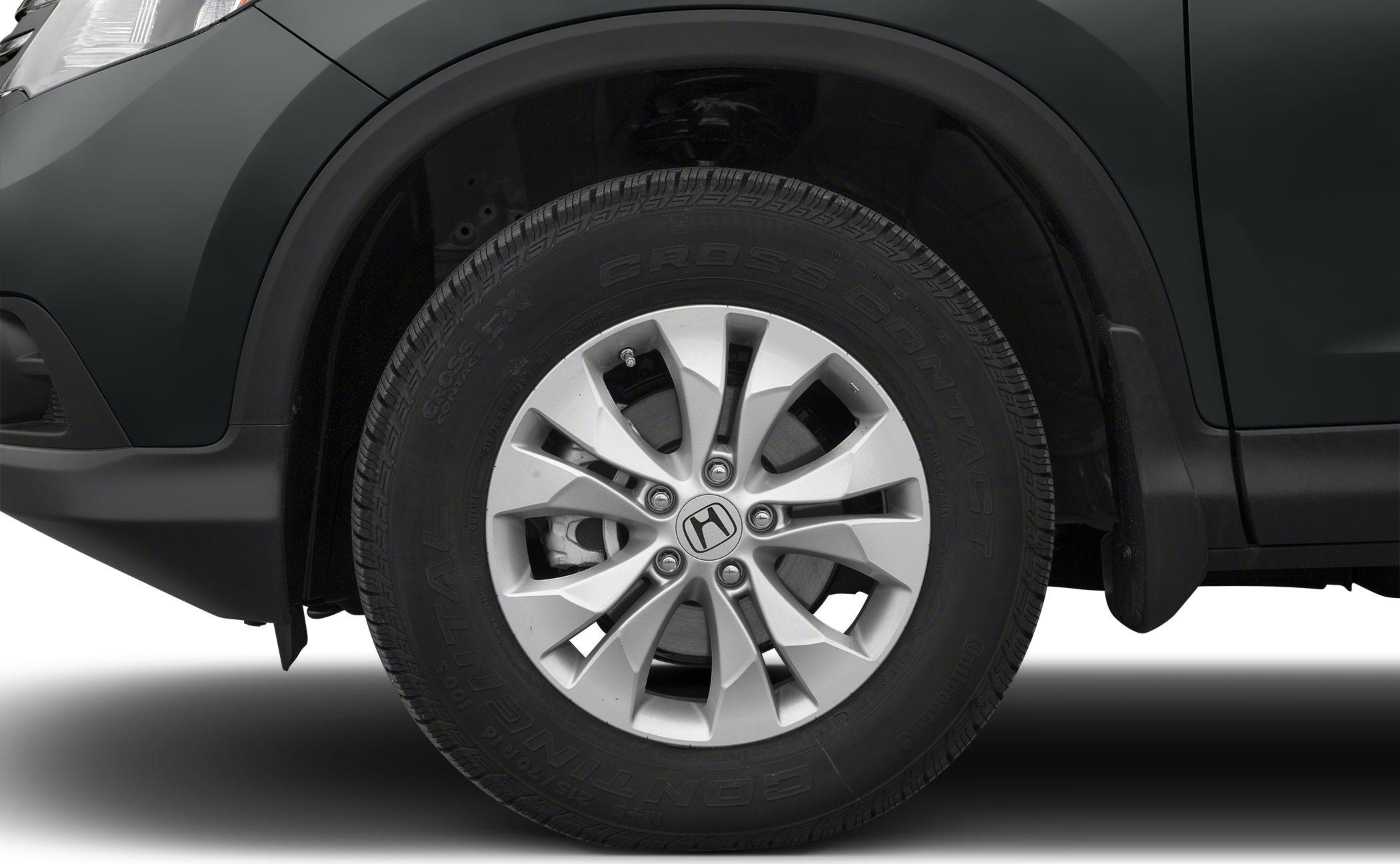 Close-up of alloy wheel and tire with tread detail