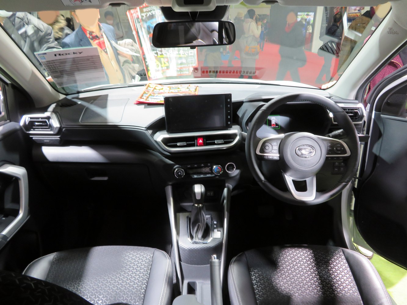 Car dashboard with touchscreen and multifunction steering wheel