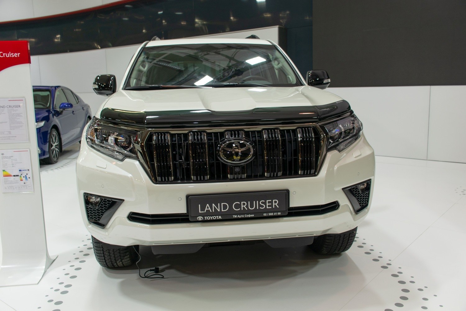 Front grille with vertical slats and LED headlights on SUV front view