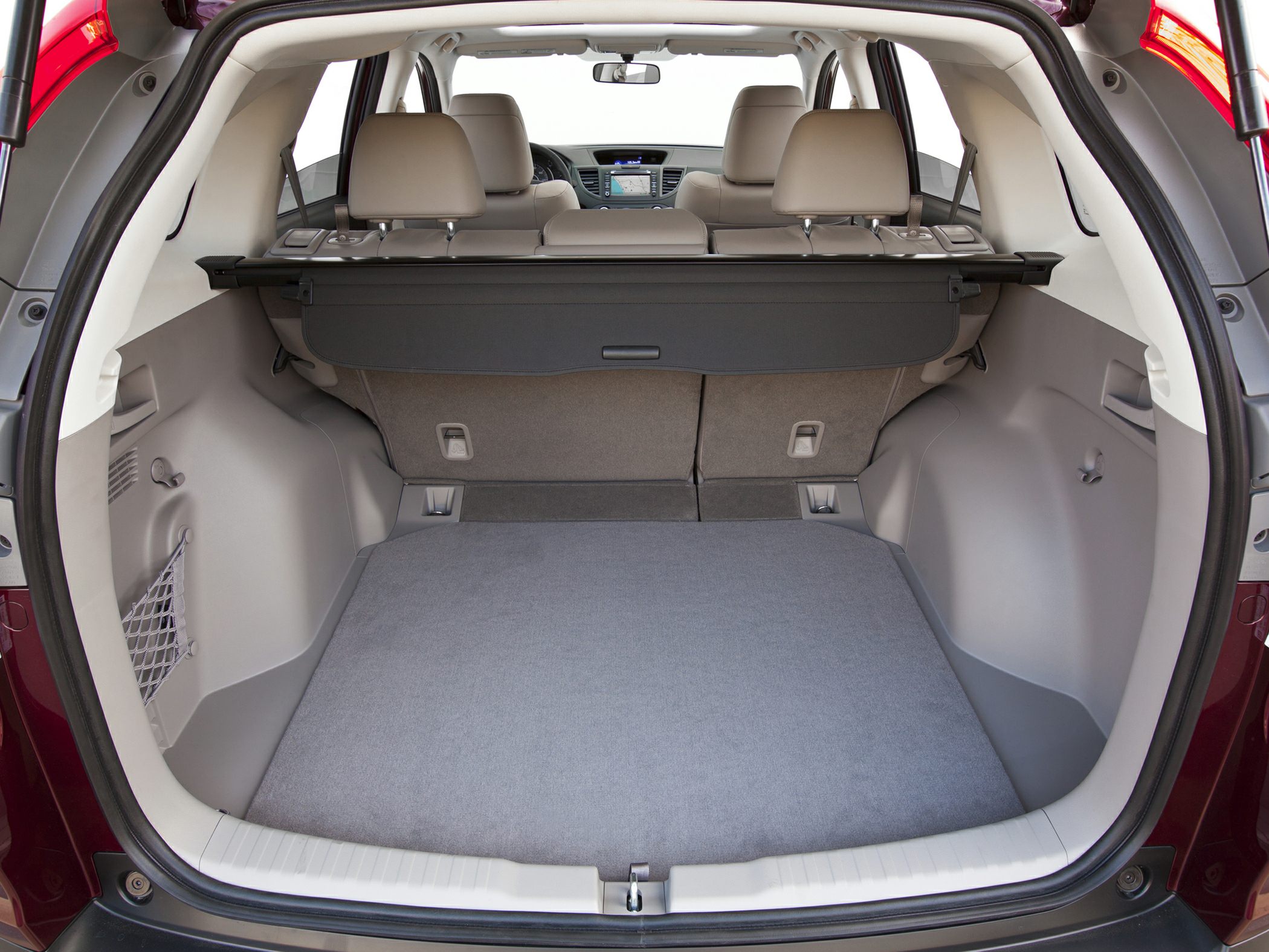 Spacious trunk with flat cargo floor and rear seats visible.