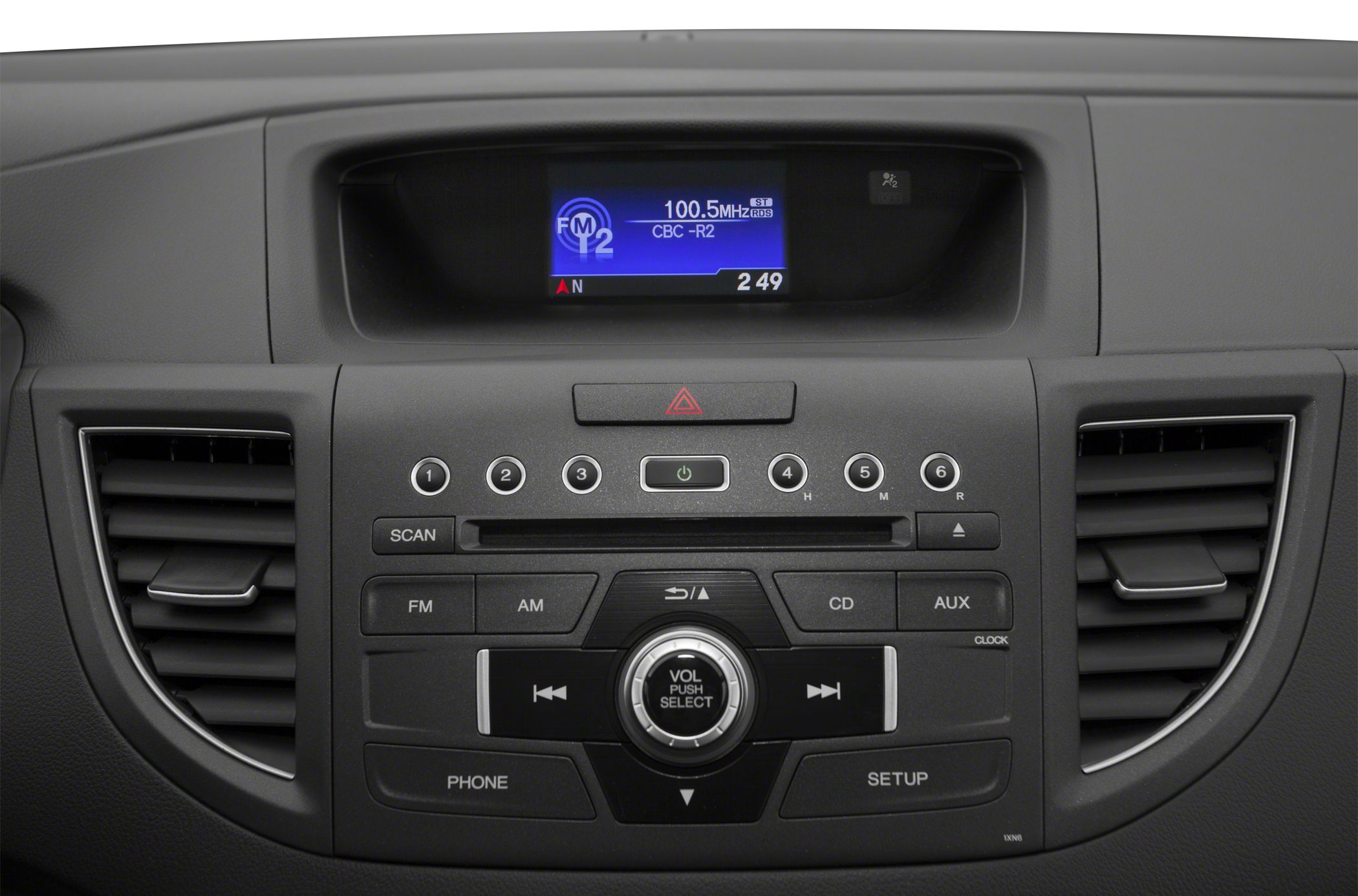 Dashboard radio control panel with climate vents and volume knob