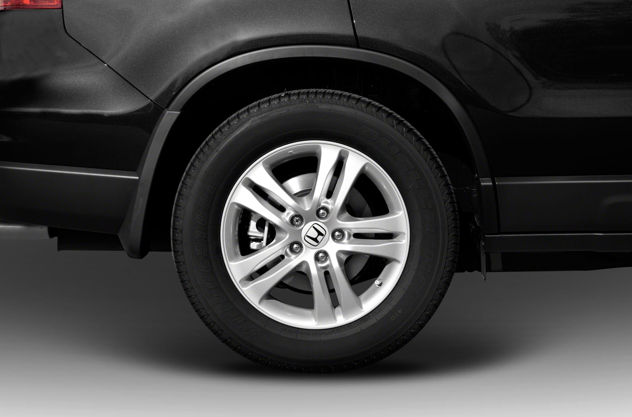 Close-up of alloy wheel and Bridgestone Dueler HT tire