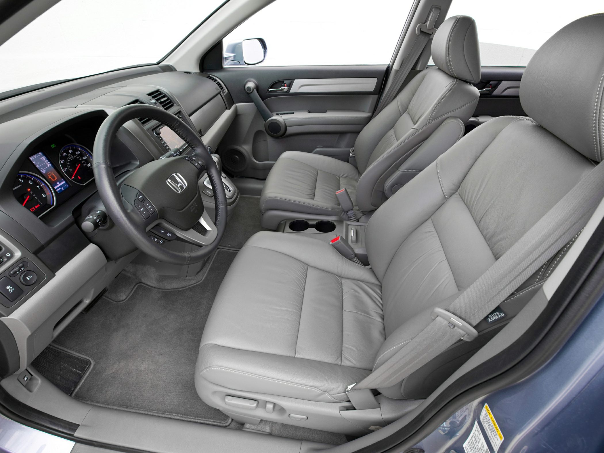 Gray leather seats and detailed dashboard with steering wheel