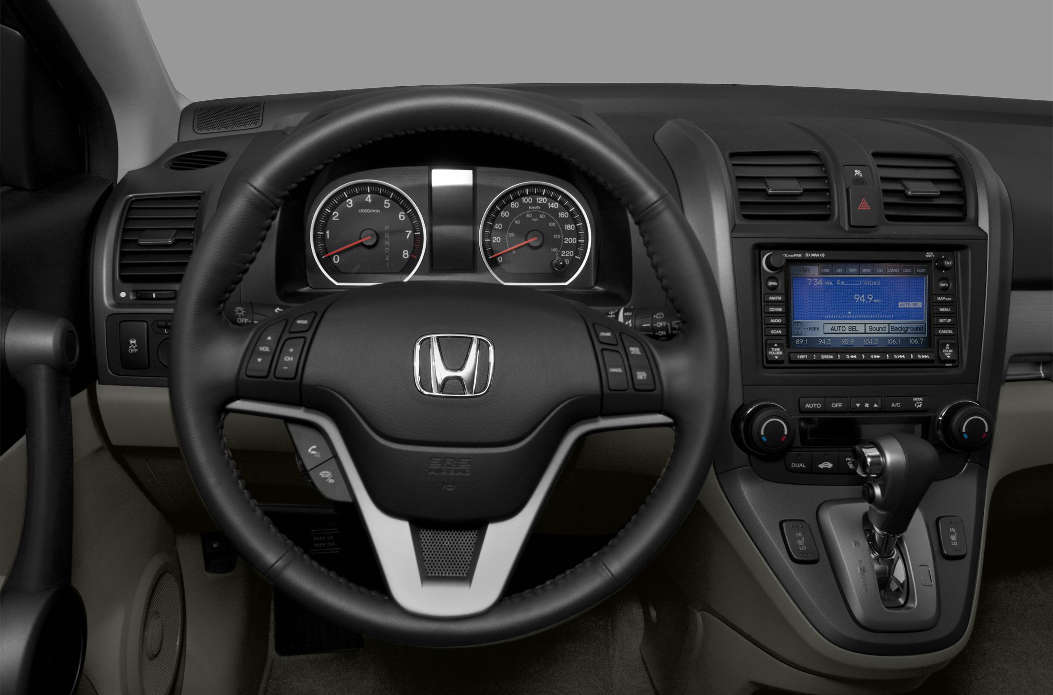 Dashboard, steering wheel, instrument cluster, and gear shifter.