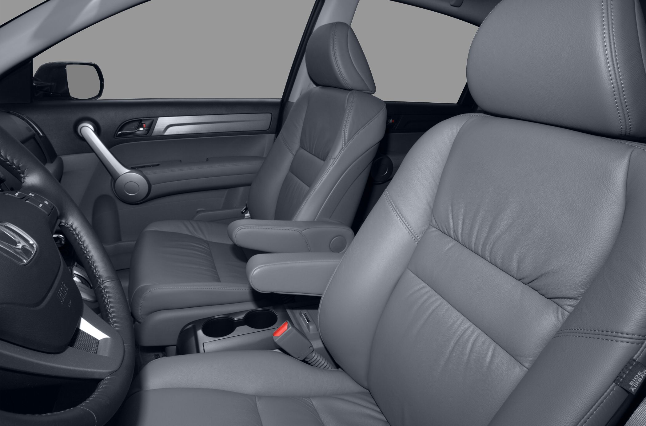 Front leather seats with armrests in car interior