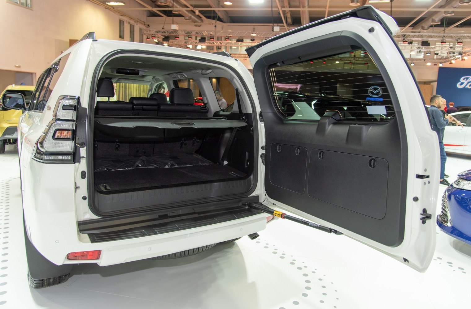Rear cargo area with open tailgate showing spacious storage