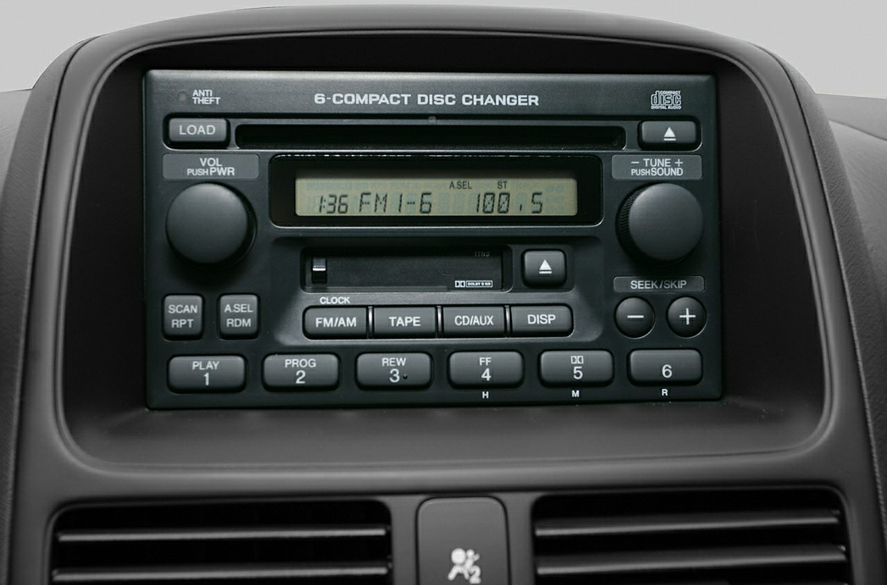 6-compact disc changer and audio controls on car dashboard