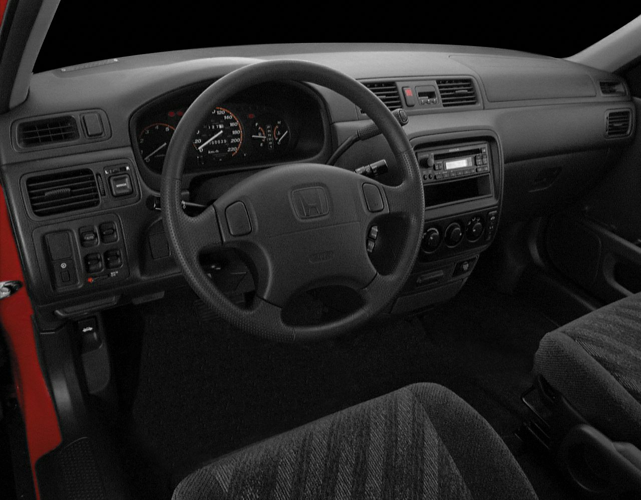 Classic dashboard and steering wheel of a 1995 SUV interior