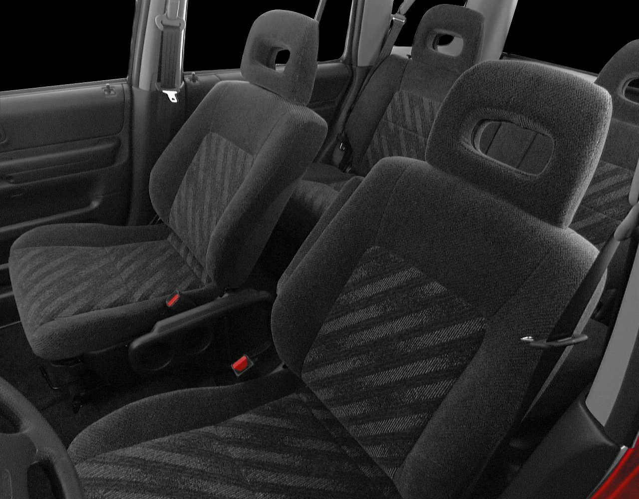 Fabric textured front and rear car seats with integrated headrests.